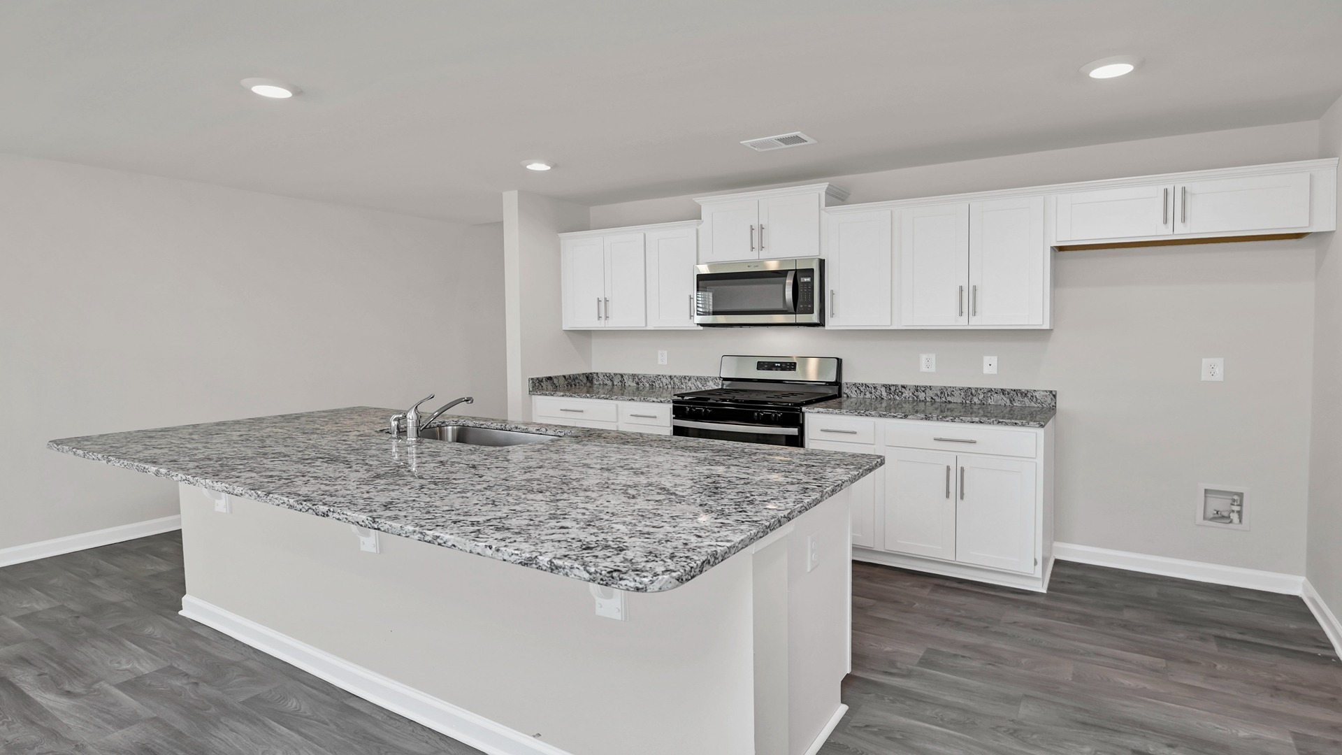 Floating island with space for barstool seating