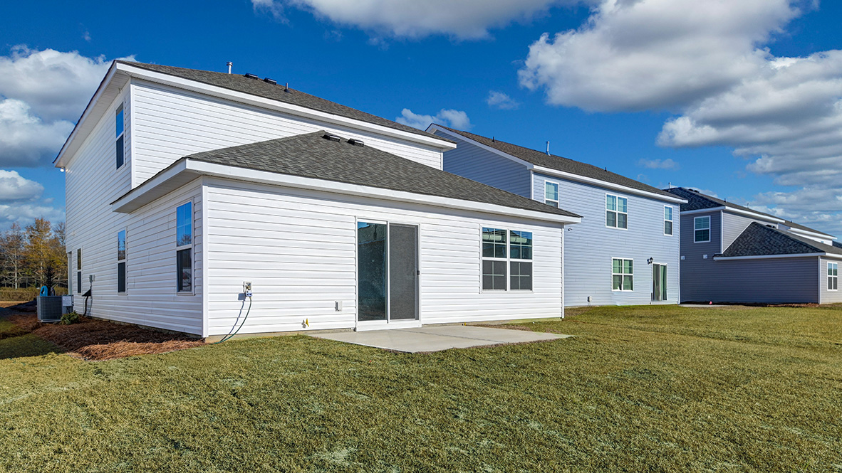 Back and side of the house finished with vinyl siding