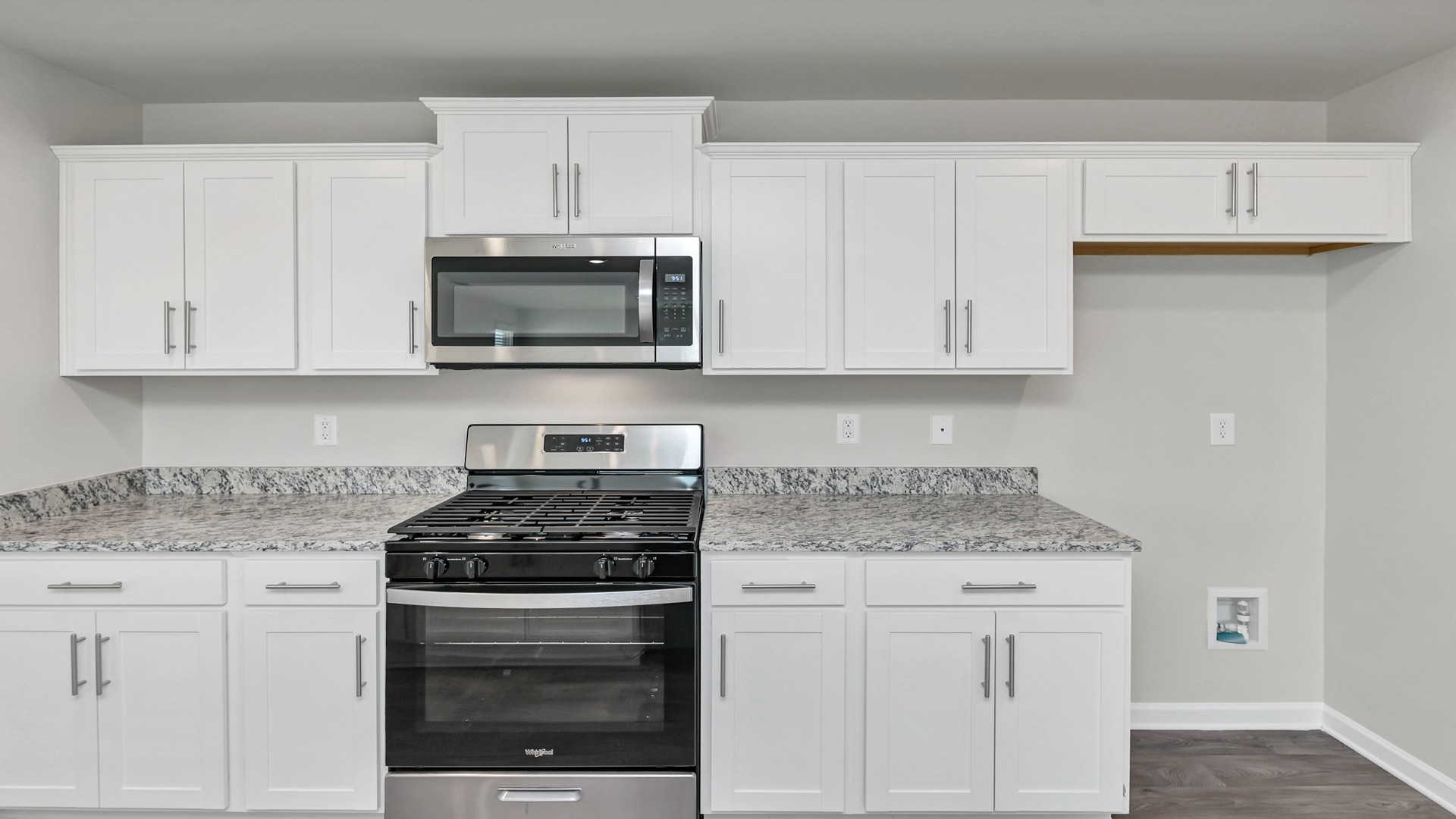 Microwave mounted above the stove
