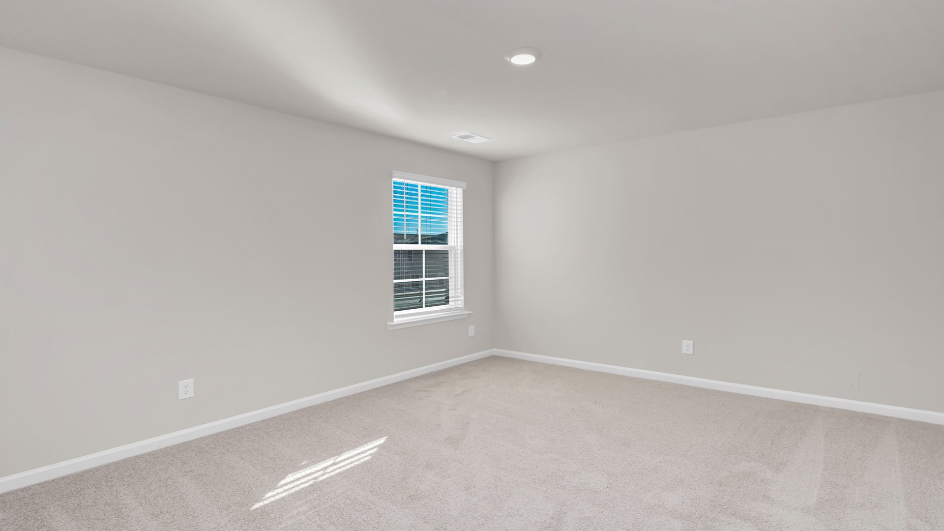 Bedroom 3 with carpet flooring and a window