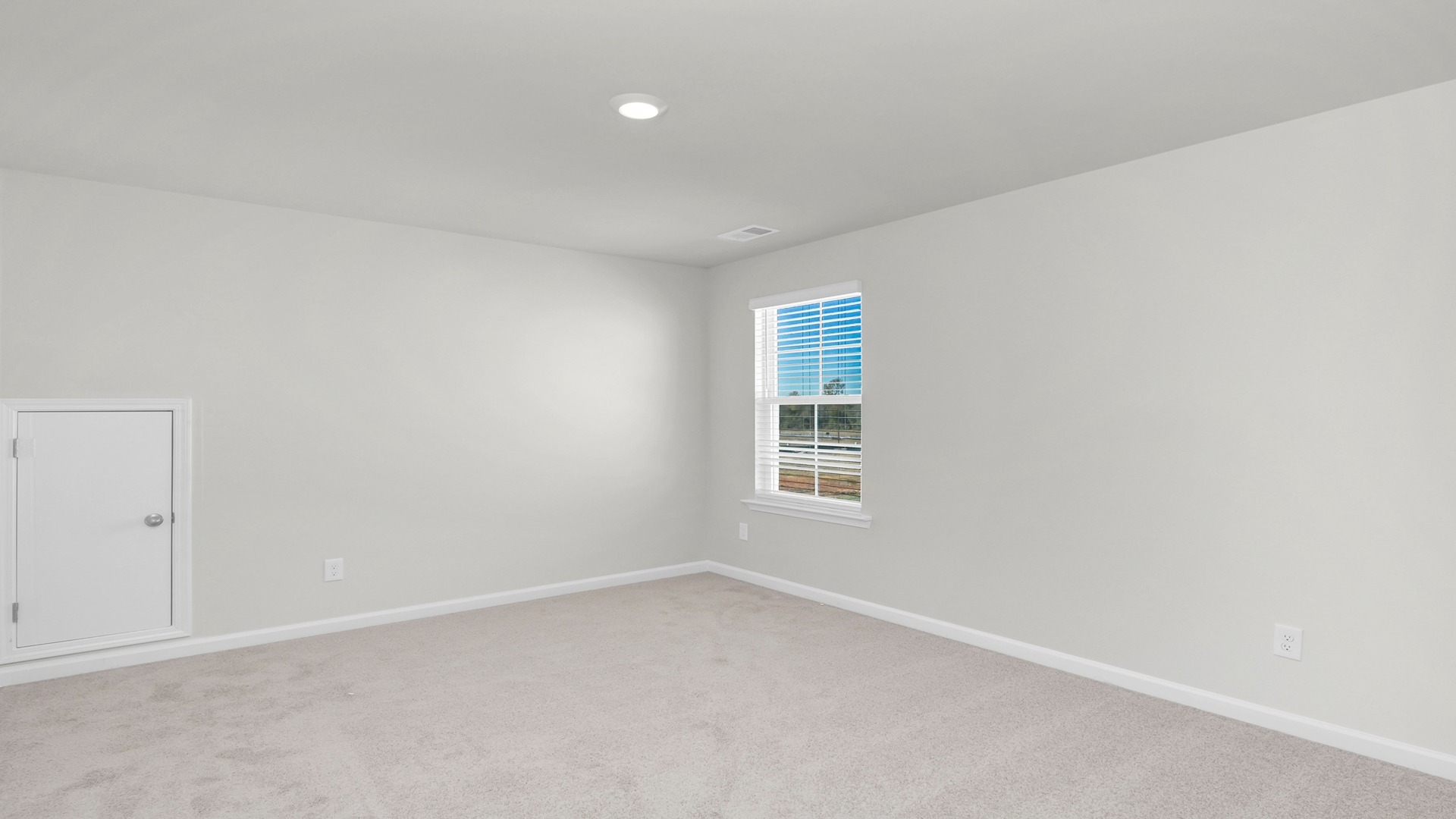 Bedroom 2 with carpet flooring and a window