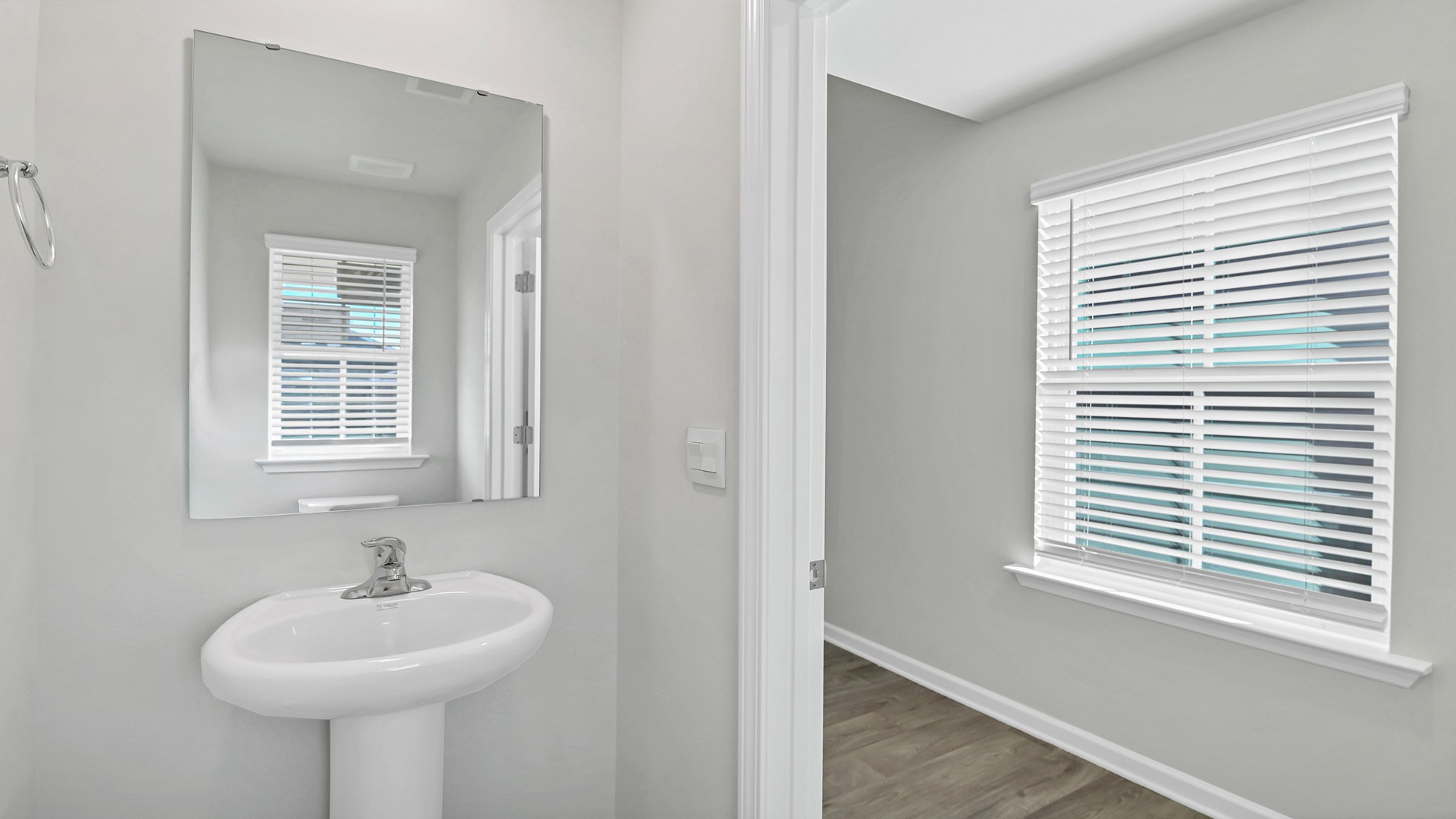 Convenient first-floor powder room back at the front foyer of new home for sale