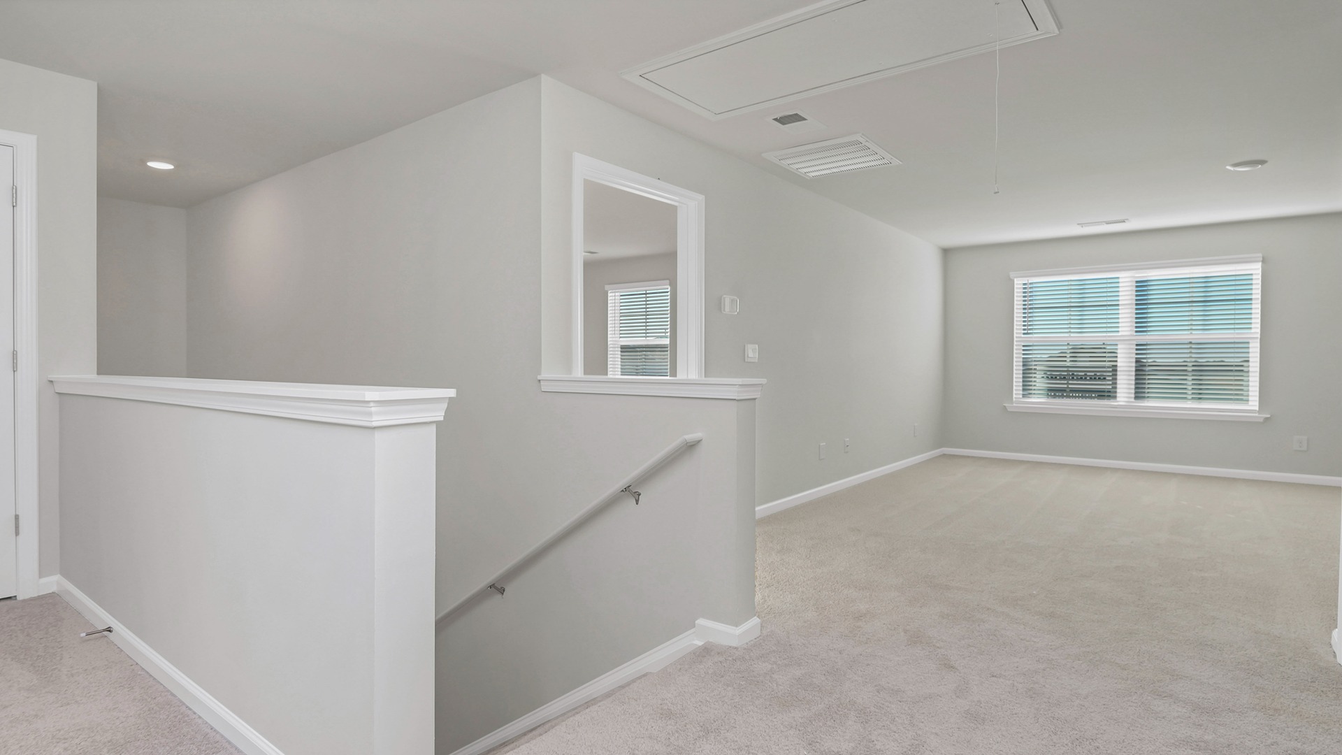 Upstairs stair landing opens up to into upstairs loft/secondary living area