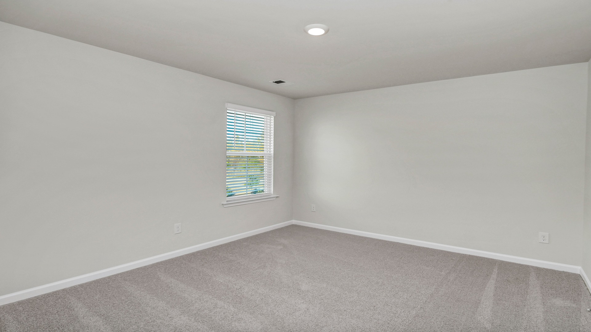 Bedroom 3 upstairs with a window for light, carpet floors, and neutral walls
