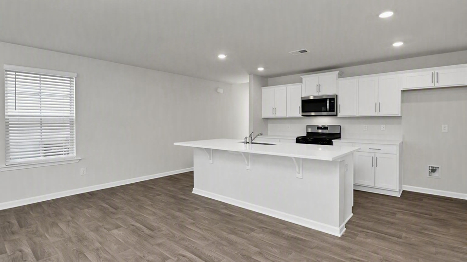 White quartz countertops and white cabinets in Manning new construction kitchen