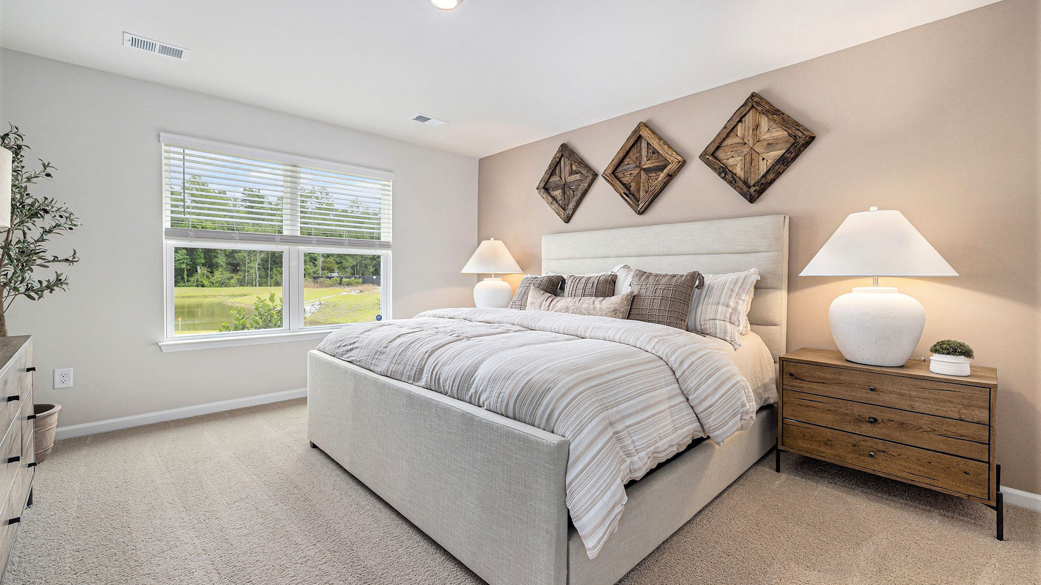 The primary bedroom is downstairs with carpet flooring