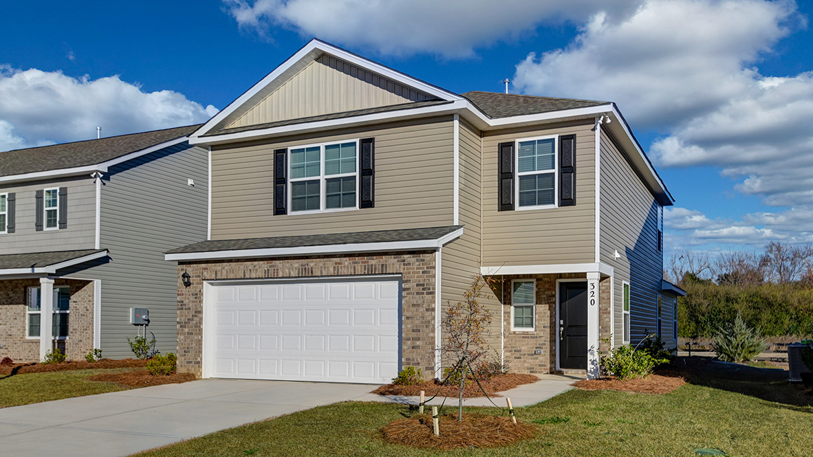 2-car garage and brick accents on this home