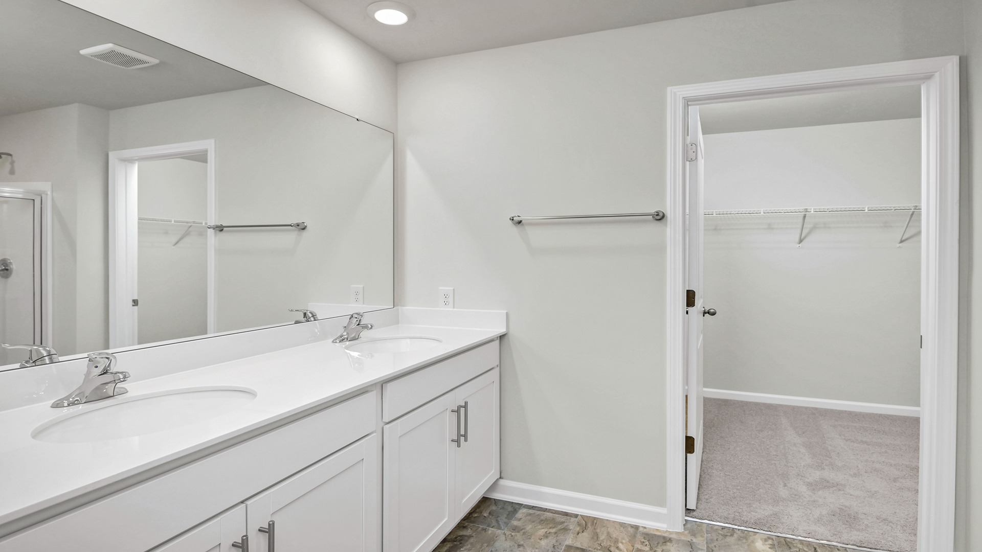 En-suite primary bathroom and walk-in closet