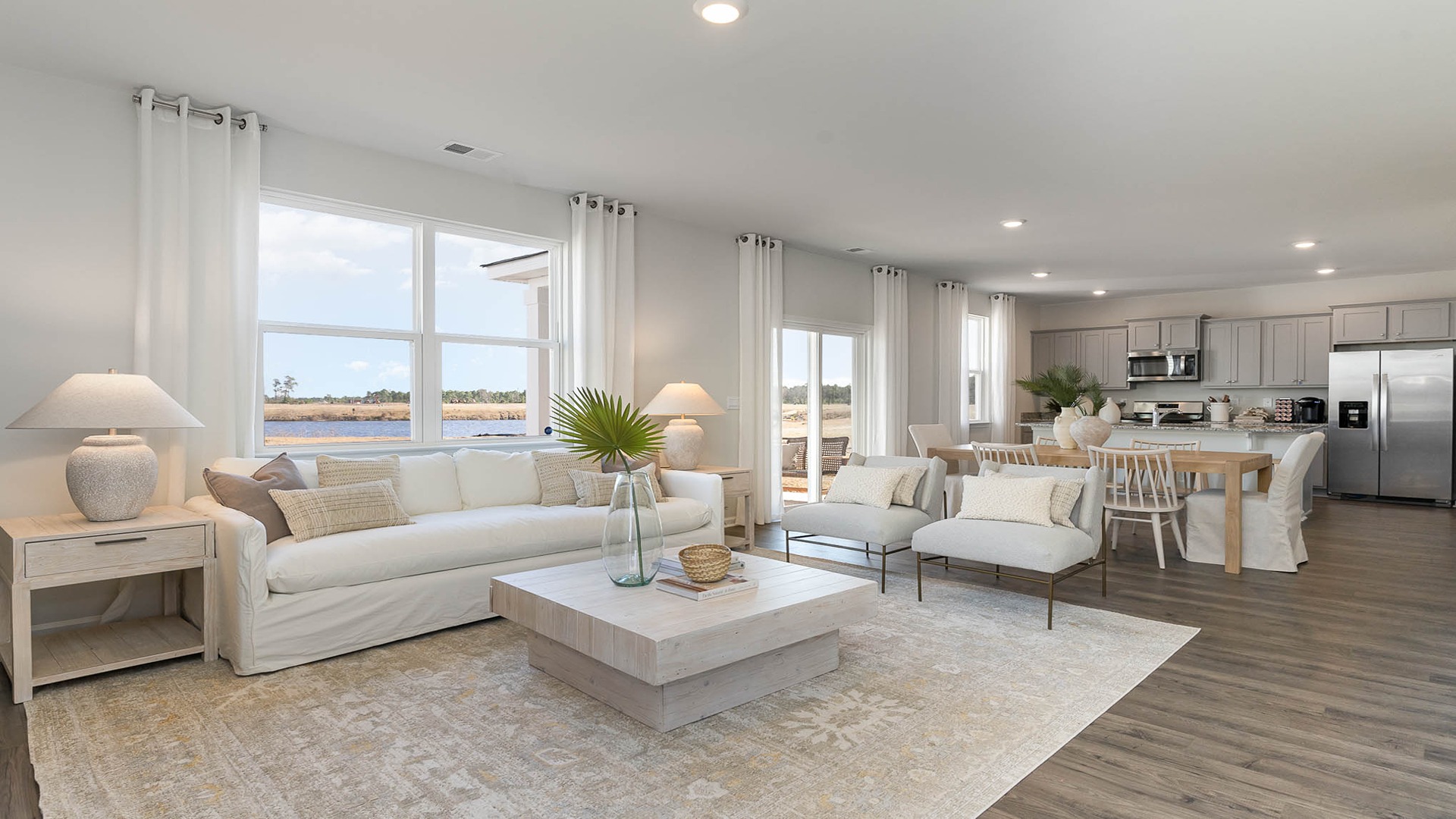 Open concept first floor with modern vinyl flooring