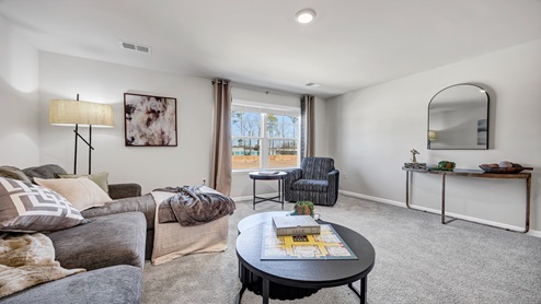 There is a large loft/secondary living space upstairs.