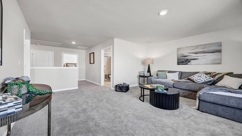 There is a large loft/secondary living space upstairs.