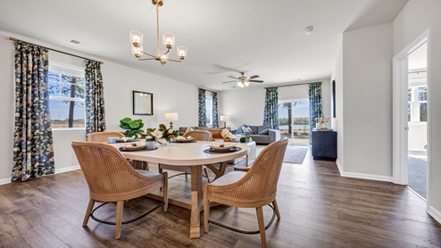The dining area sits between the kitchen and living spaces.