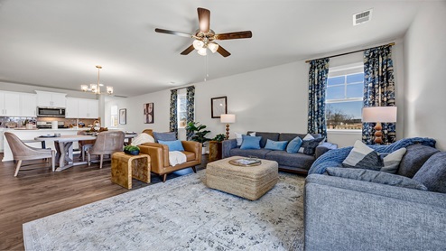 You can view the dining and kitchen spaces from the living area.