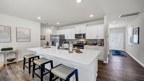There is room for barstool seating at the floating kitchen island.