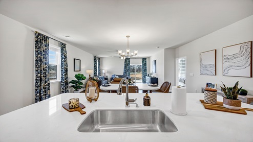 The kitchen sink is on the floating kitchen island.