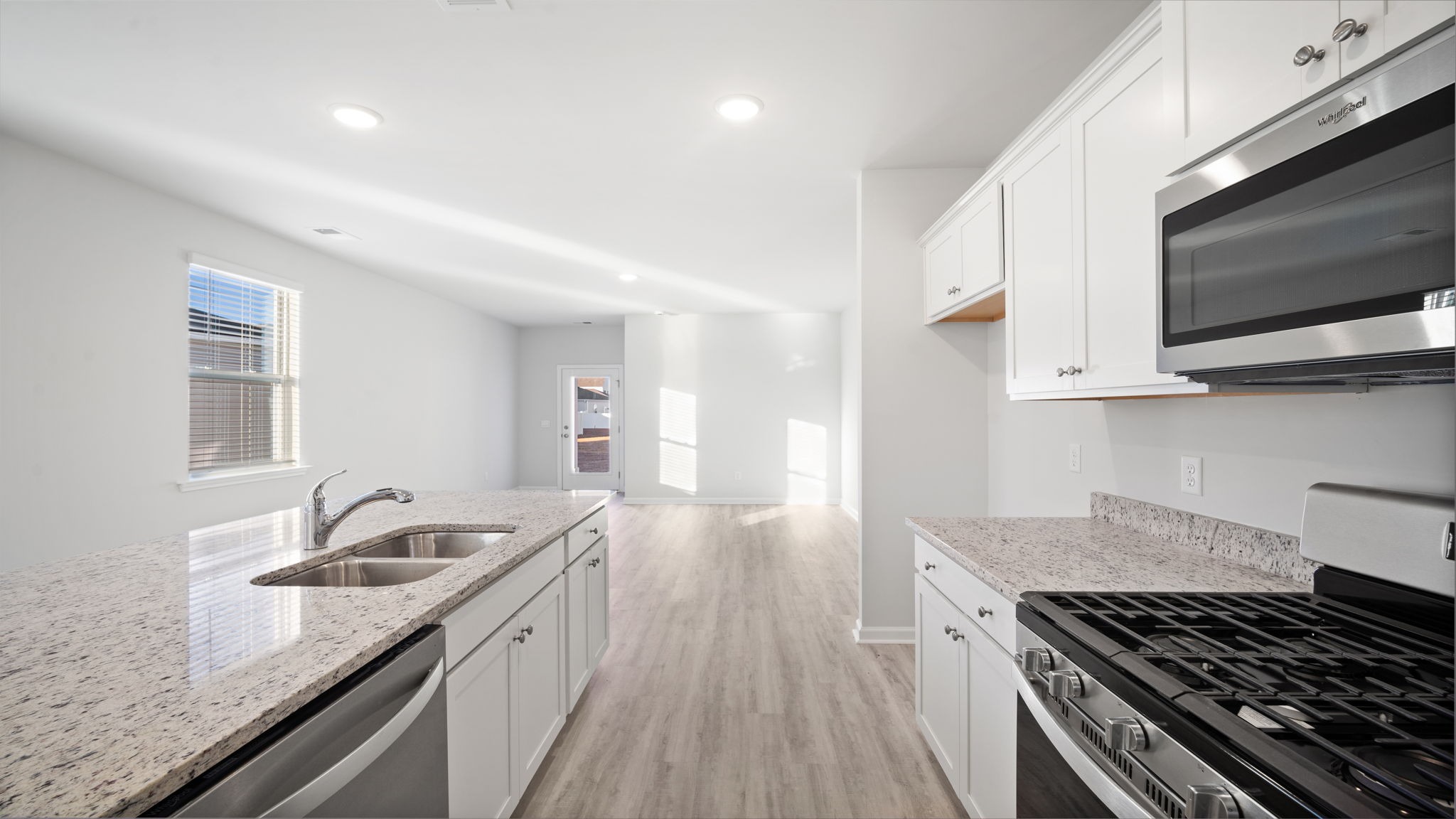 Stainless-steel kitchen appliances come with the home for sale in Sease's Pond