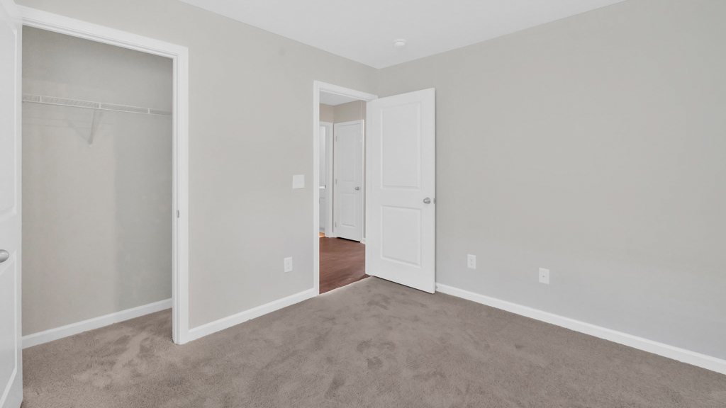 Unfurnished bedroom 2 with carpet flooring