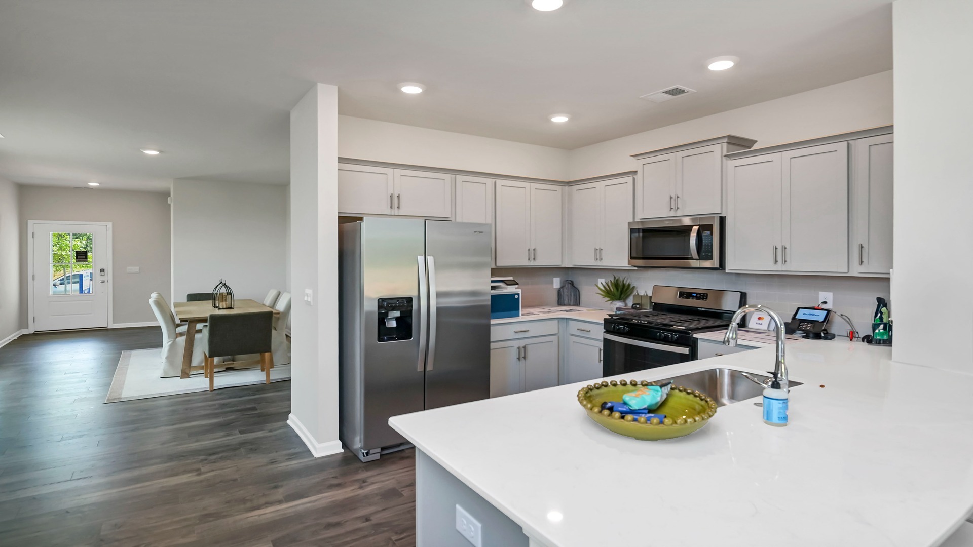 Dining area leads into the modern kitchen space of the Allex floorplan in Sease's Pond