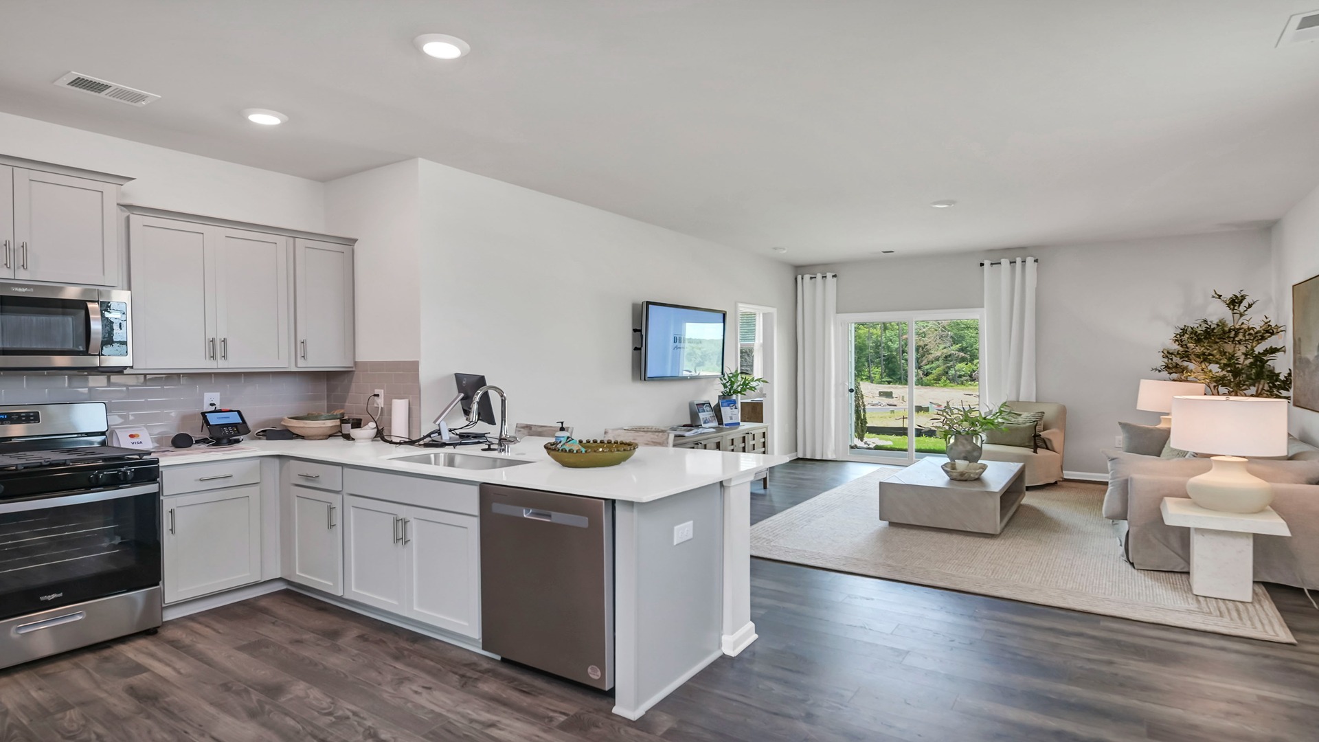 Allex kitchen bar overlooks the spacious living area