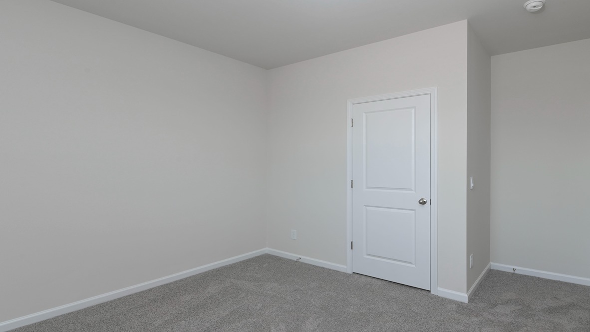 Private closet and carpet flooring in bedroom 3 of the Kerry for sale