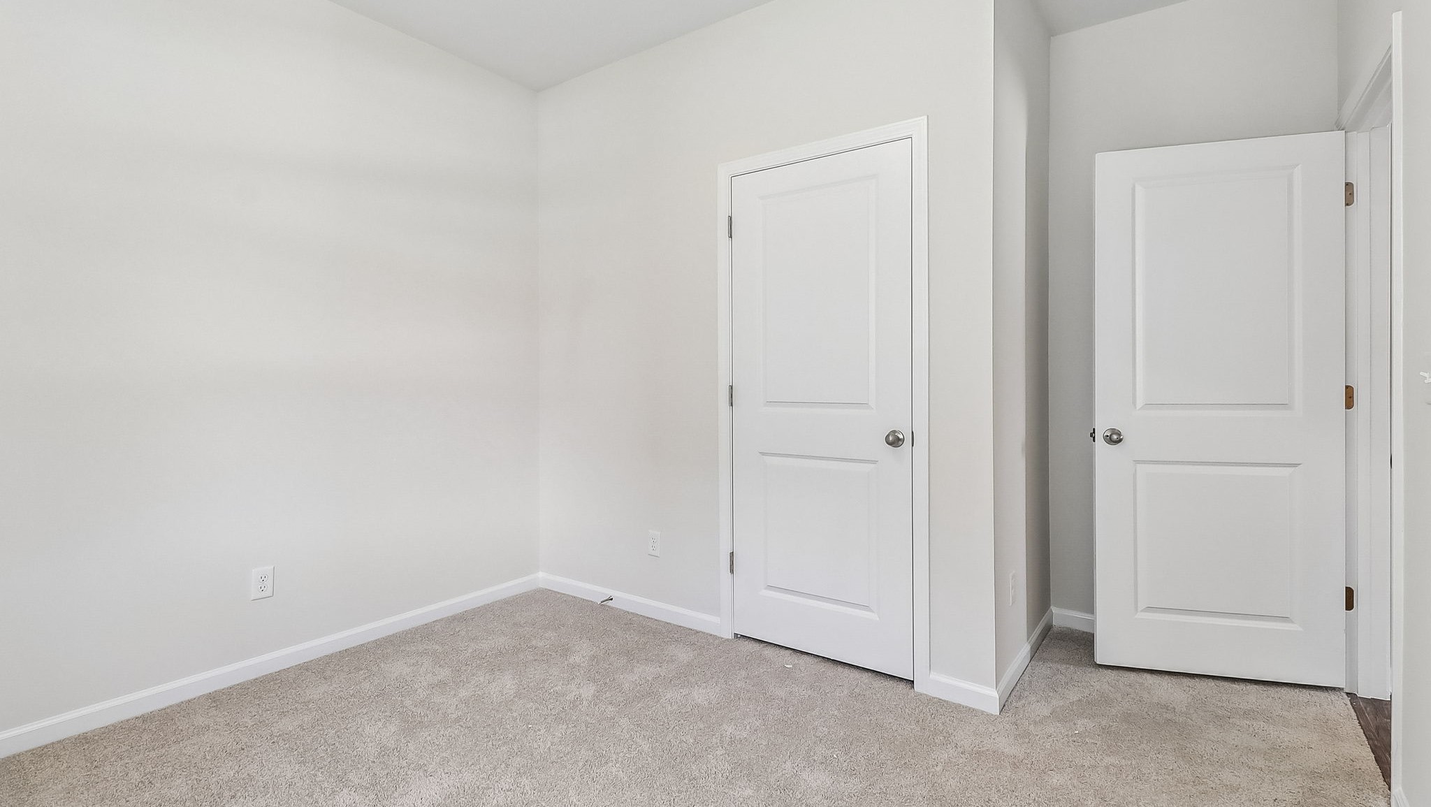 Private closet and carpet flooring in bedroom 3 of the Kerry for sale