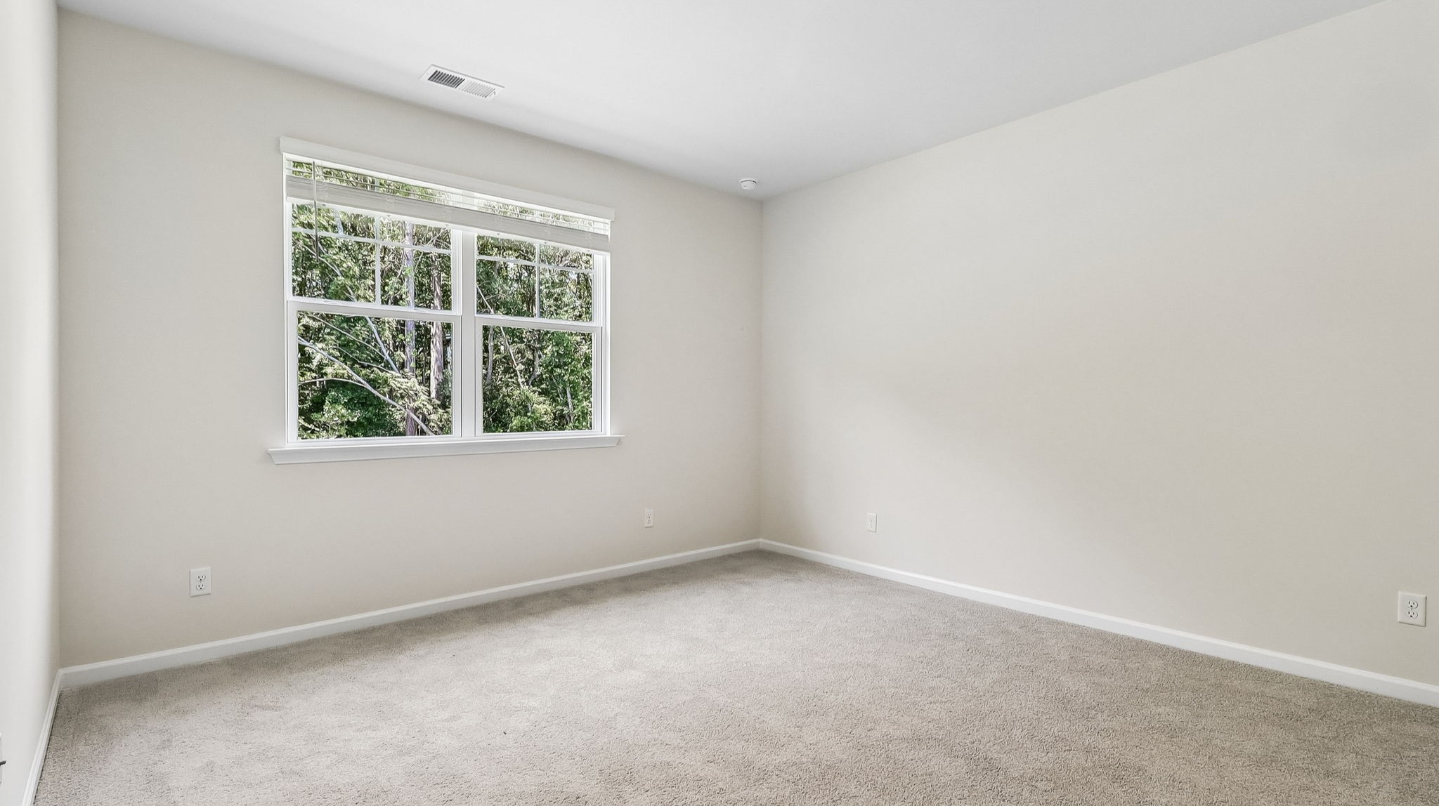 Primary bedroom privately at the back of the Kerry floorplan