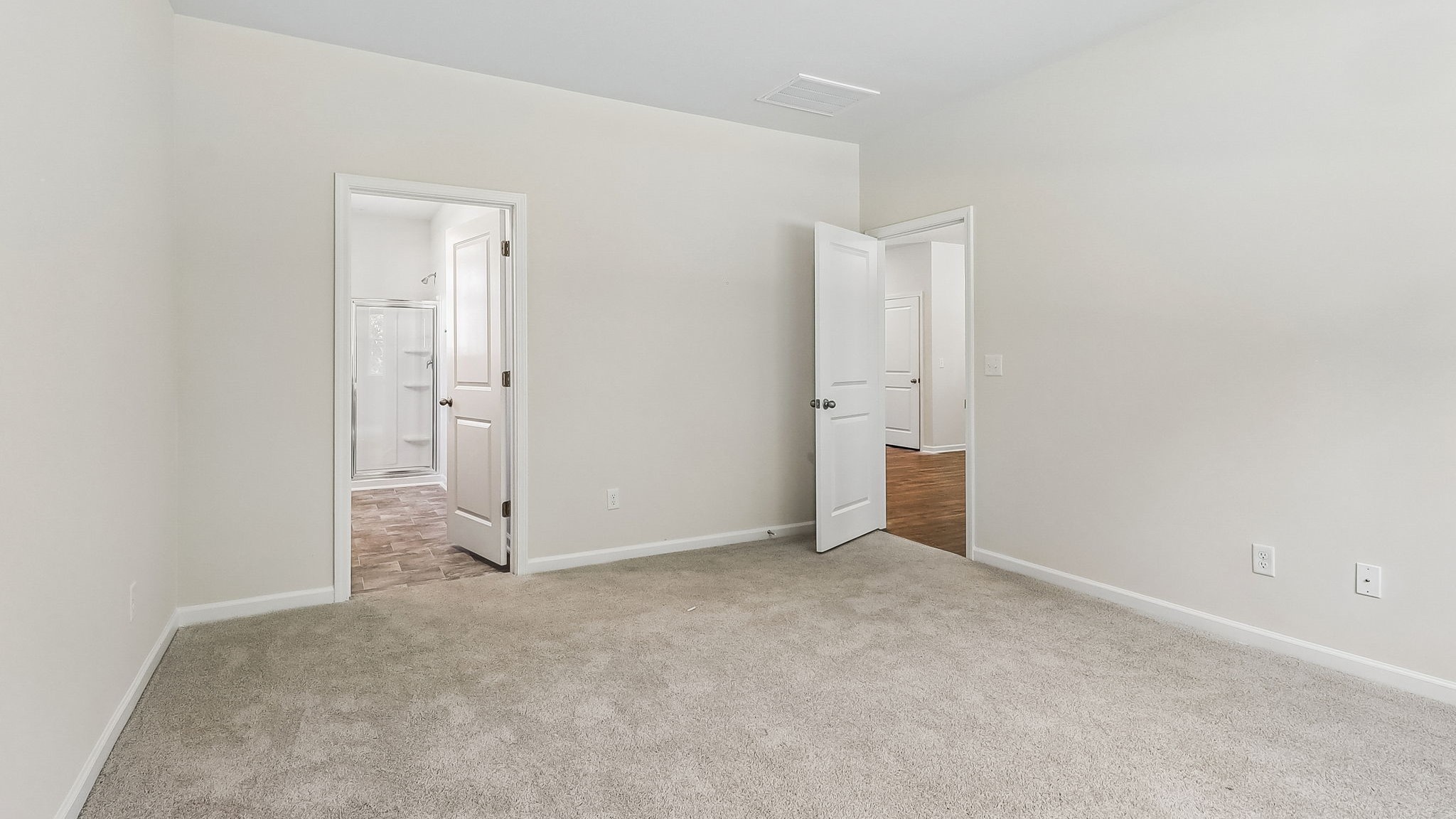 Primary bedroom in home for sale in Lexington with direct access to en-suite bathroom and walk-in closet
