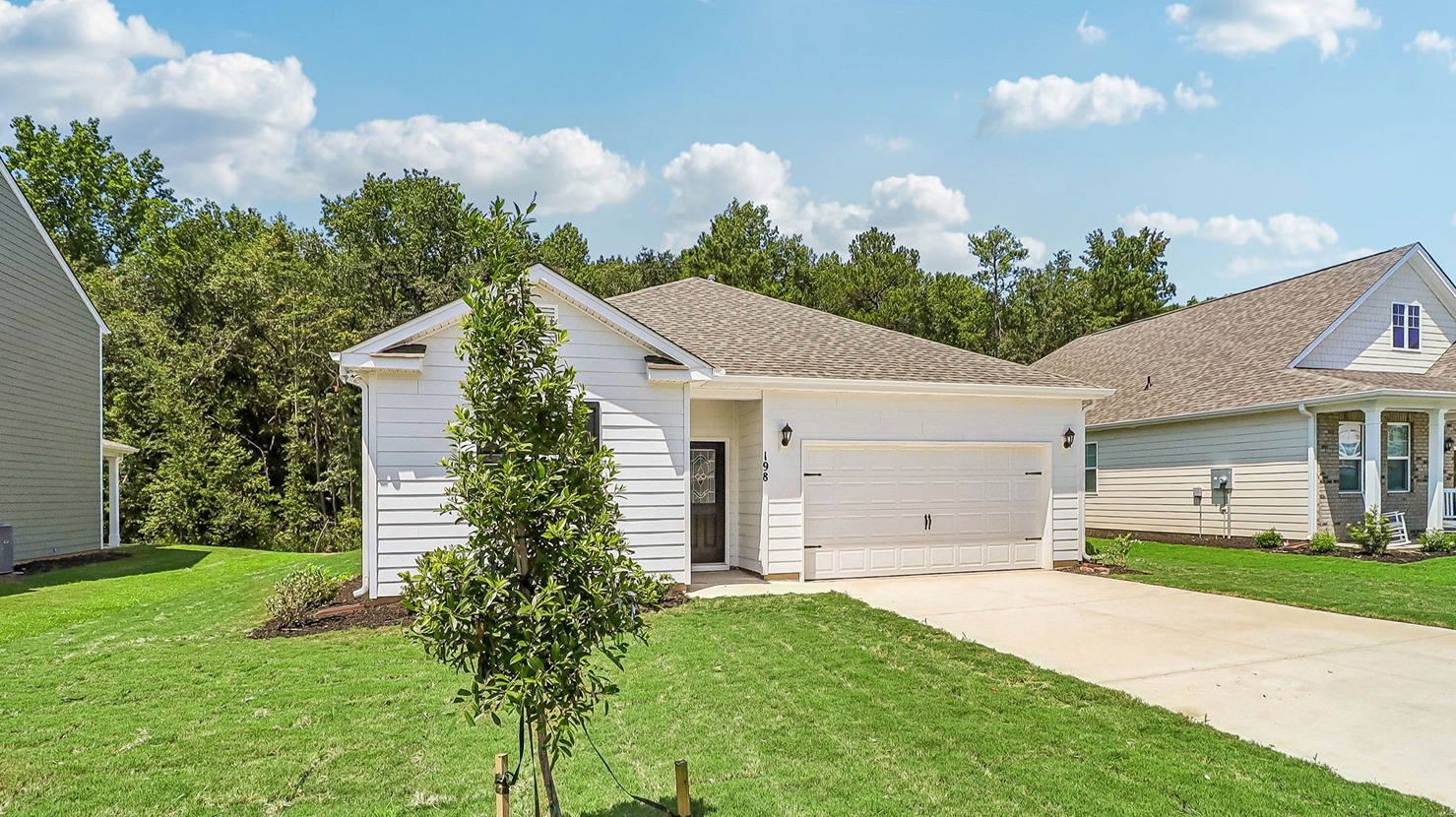 Exterior of home for sale in Sease's Pond with landscaping and spacious yards