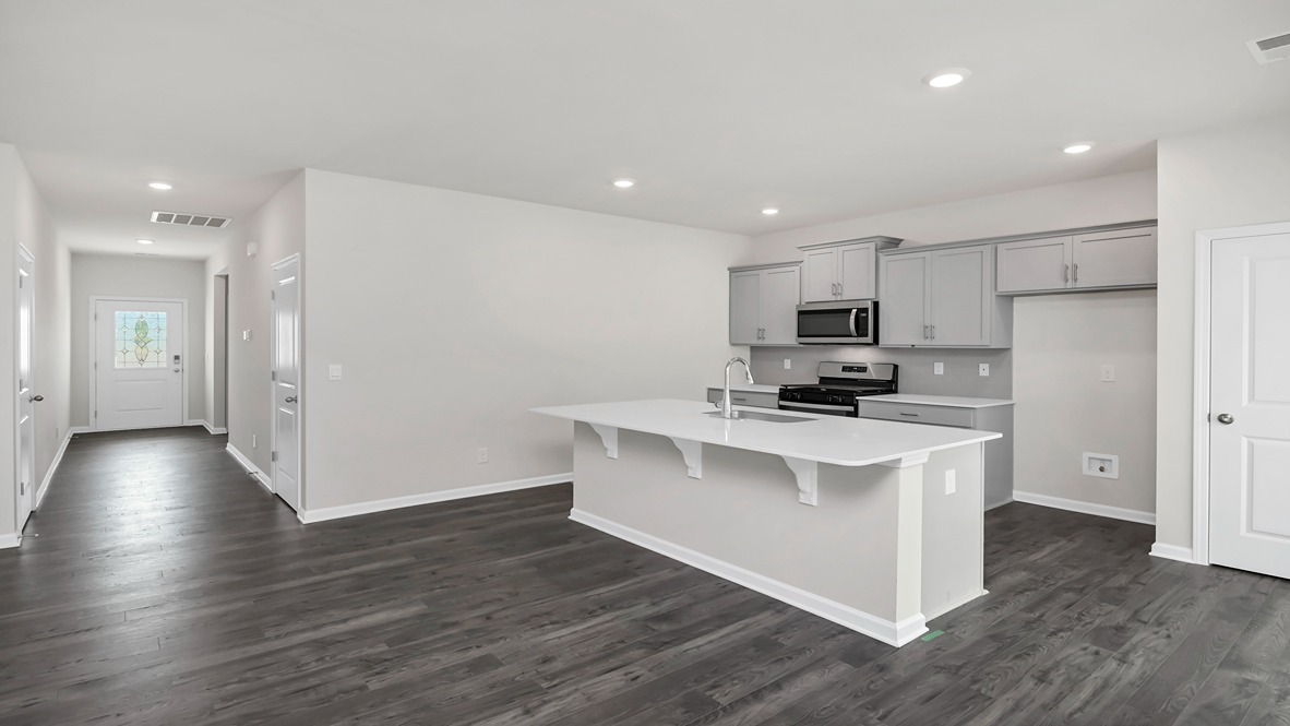 The front foyer opens up into the main living areas and the open kitchen space