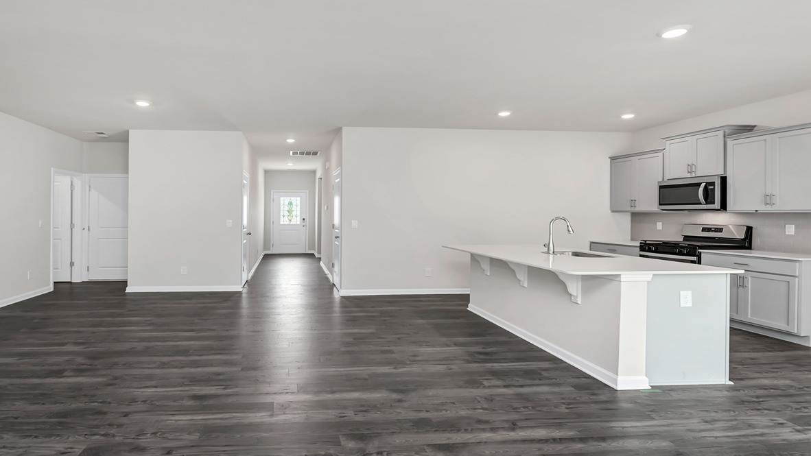 Back out into the main living areas and down the front foyer to get to remaining bedrooms