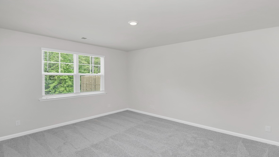 Primary bedroom privately at the back of the Kerry floorplan