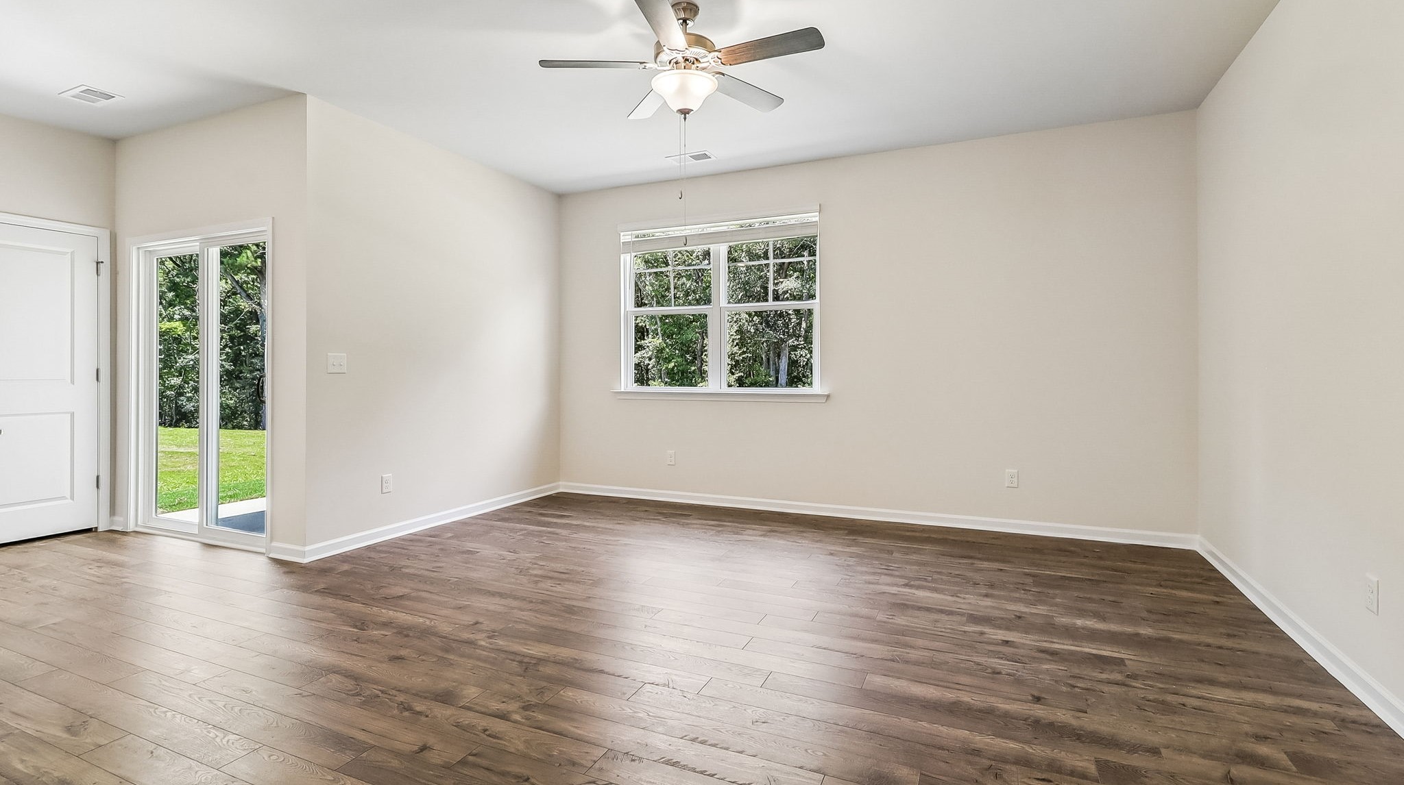 Living area with natural light and RevWood floors
