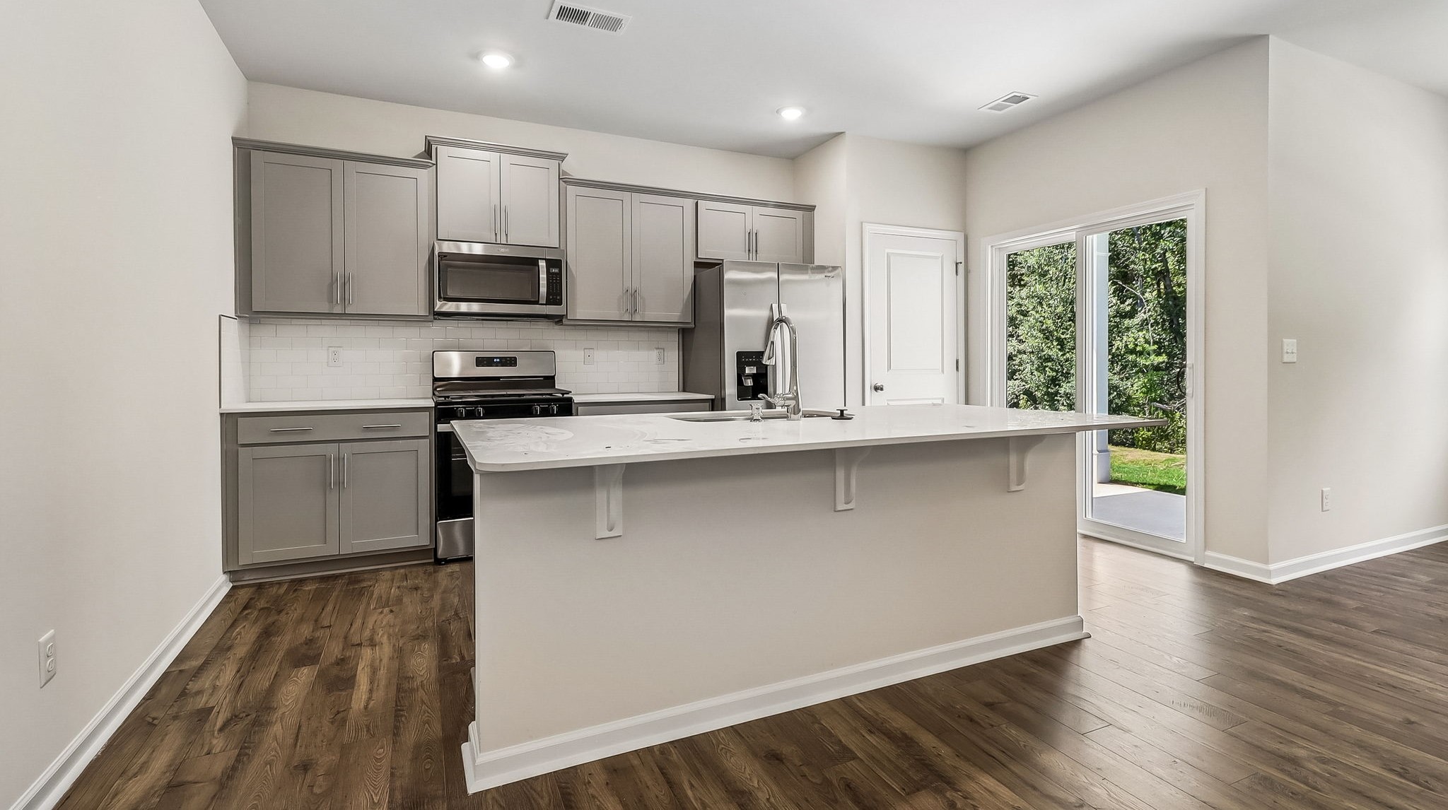 Kerry kitchen with gray cabinetry and white quartz countertops