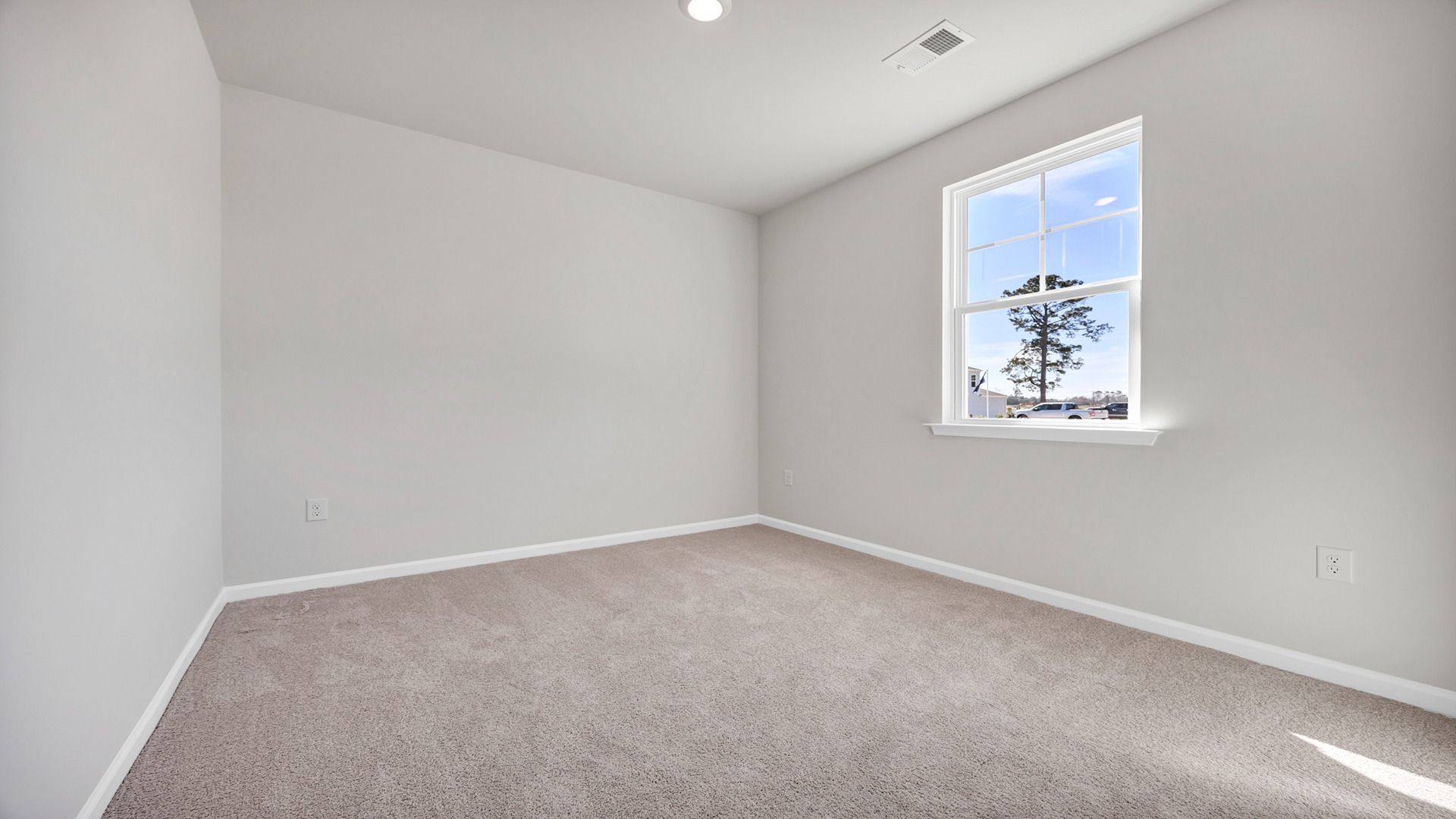 Carpet floors and window in bedroom 2 of Kerry floorplan