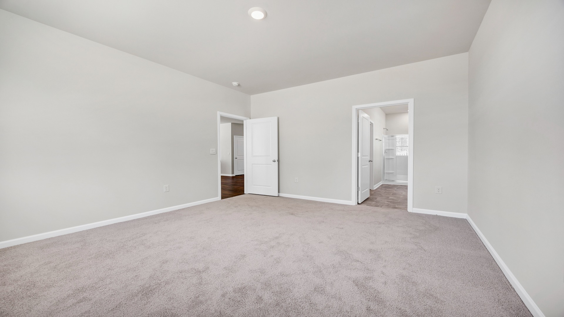 Access to en-suite closet and bathroom from the primary bedroom