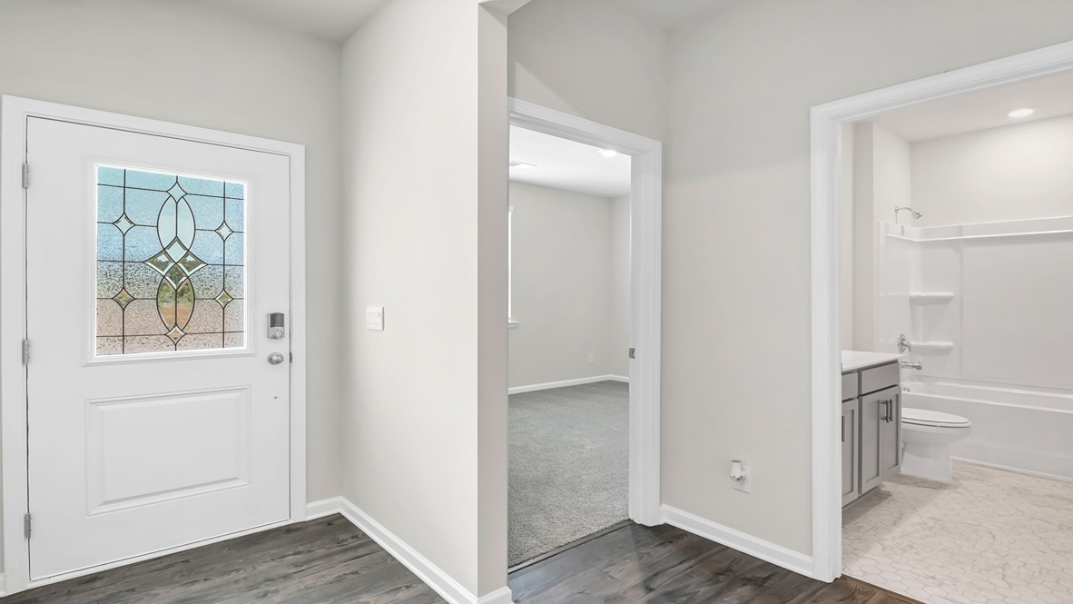 The front foyer leads to the remaining bedrooms and bathroom.