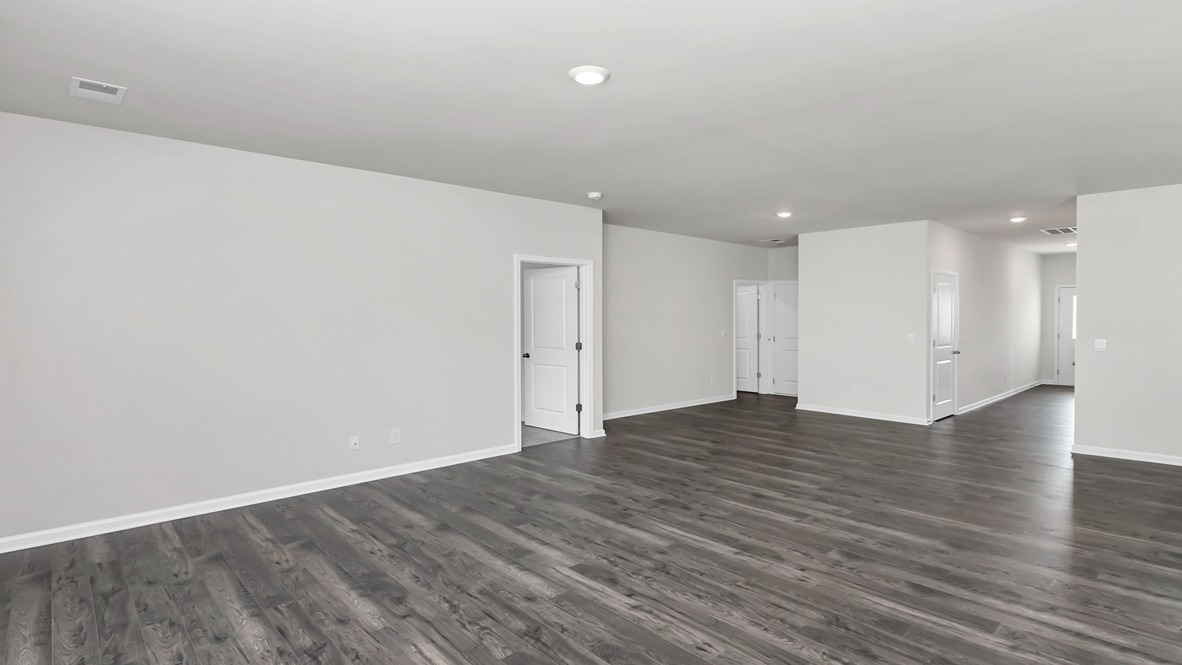 Access to the primary suite is off the living area.