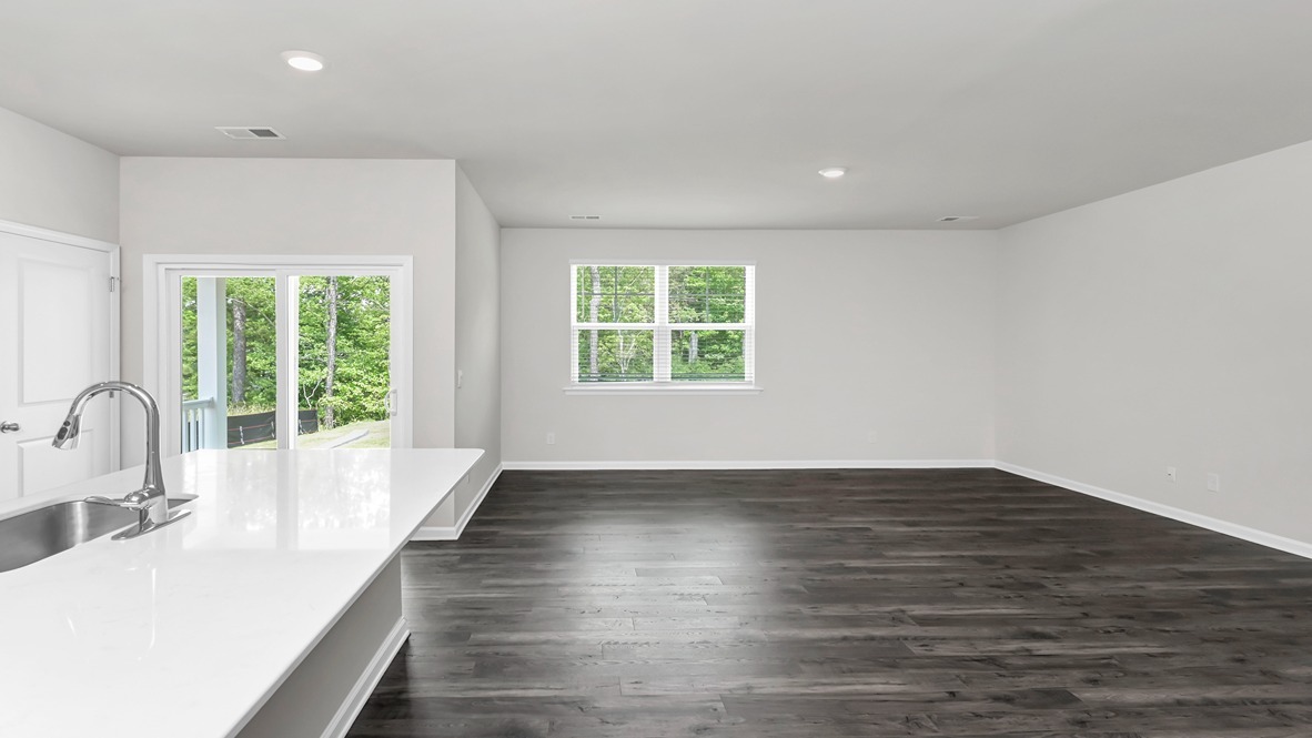 Luxury vinyl flooring finishes the kitchen, dining, and living areas.