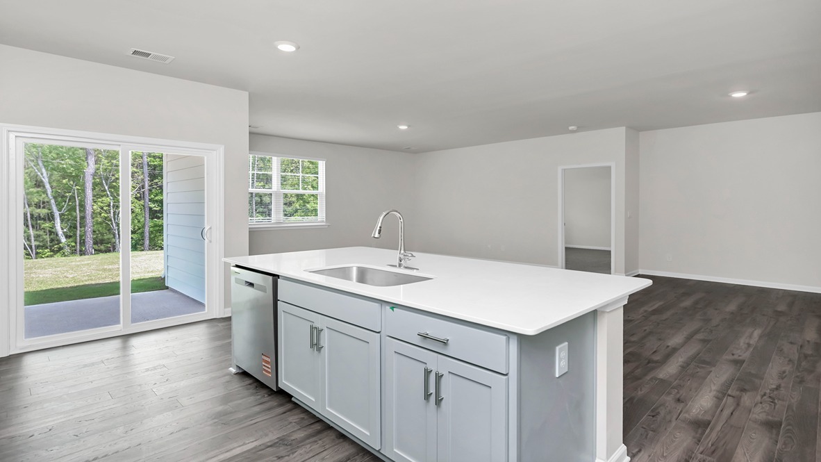 Glass doors in the kitchen lead to the back patio