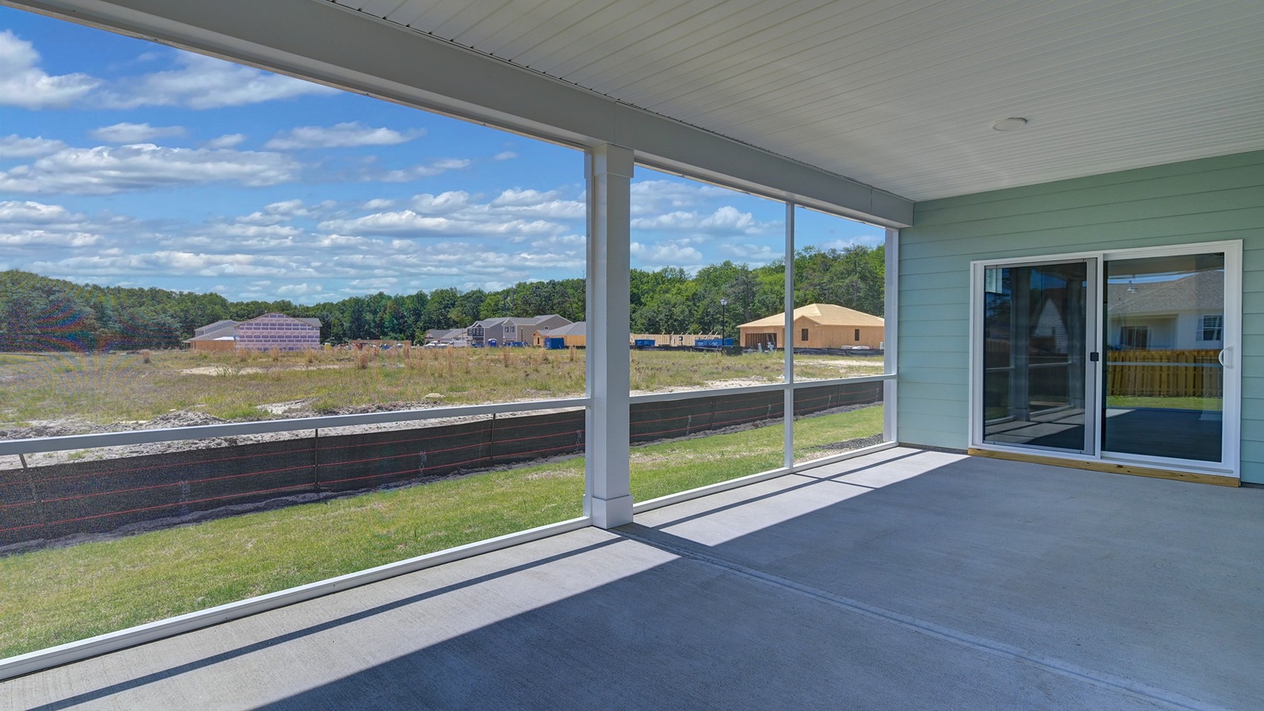 Screened-in back patio on home for sale in Sease's Pond