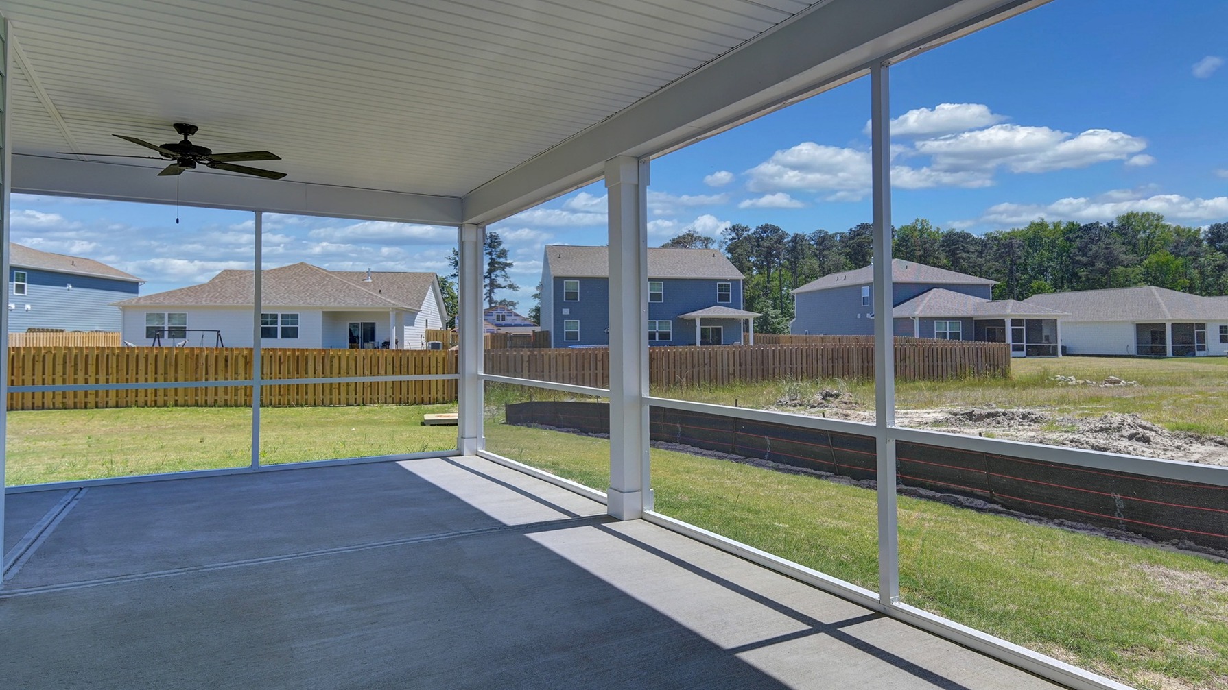 Large, extended back patio screened-in
