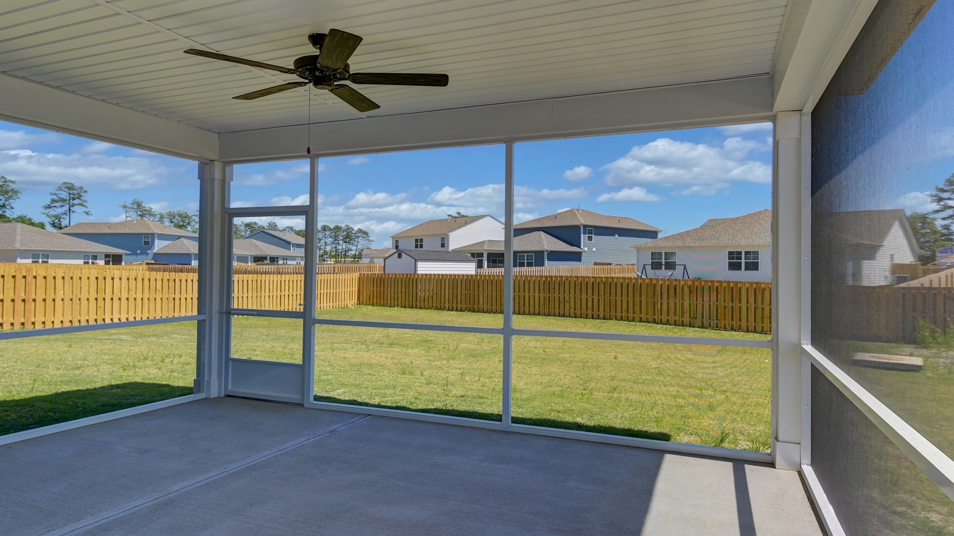 Screened-in back patio on home for sale in Sease's Pond