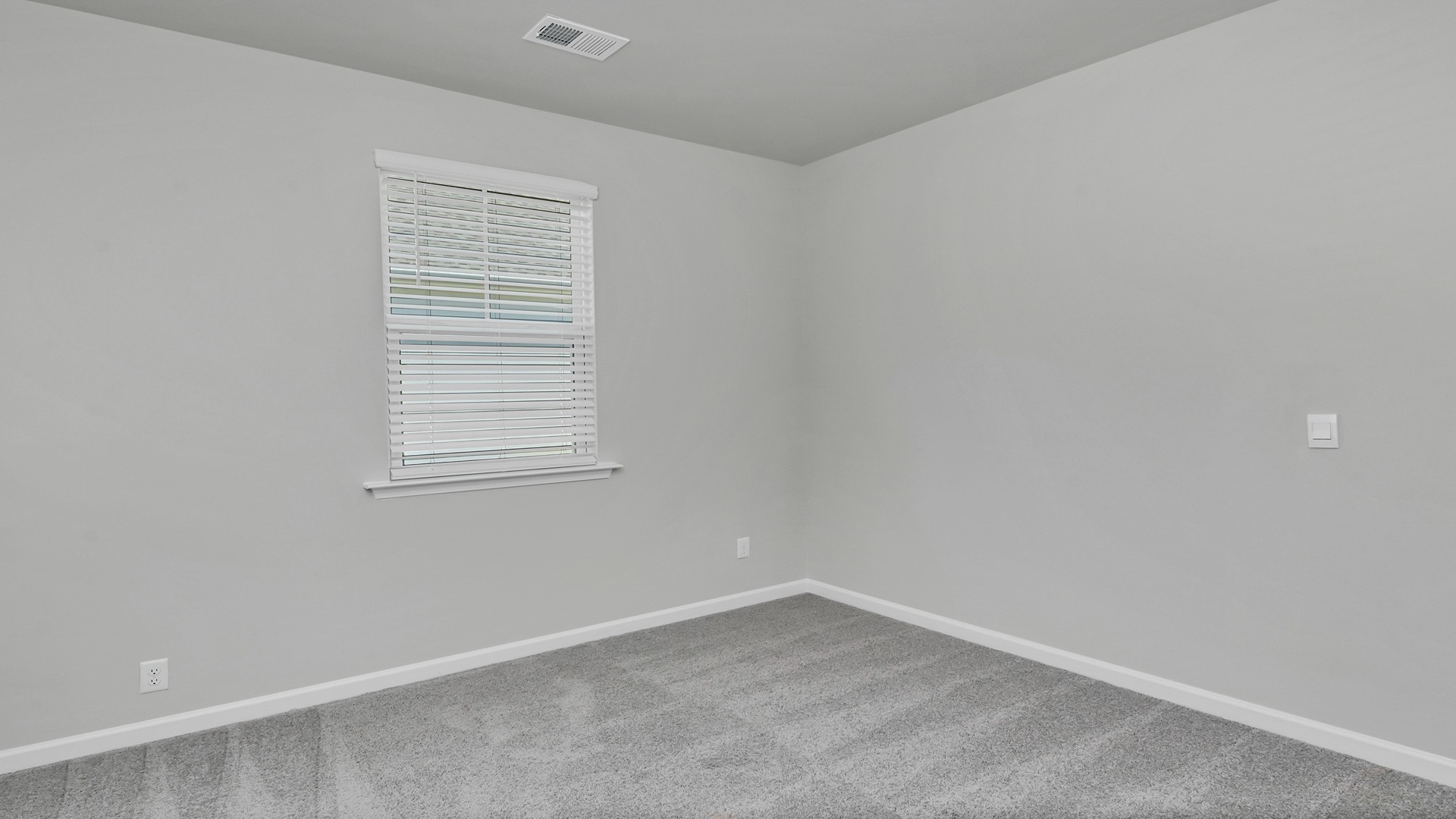 Bedroom 3 with carpet flooring and a window for light in the Allex in Sease's Pond