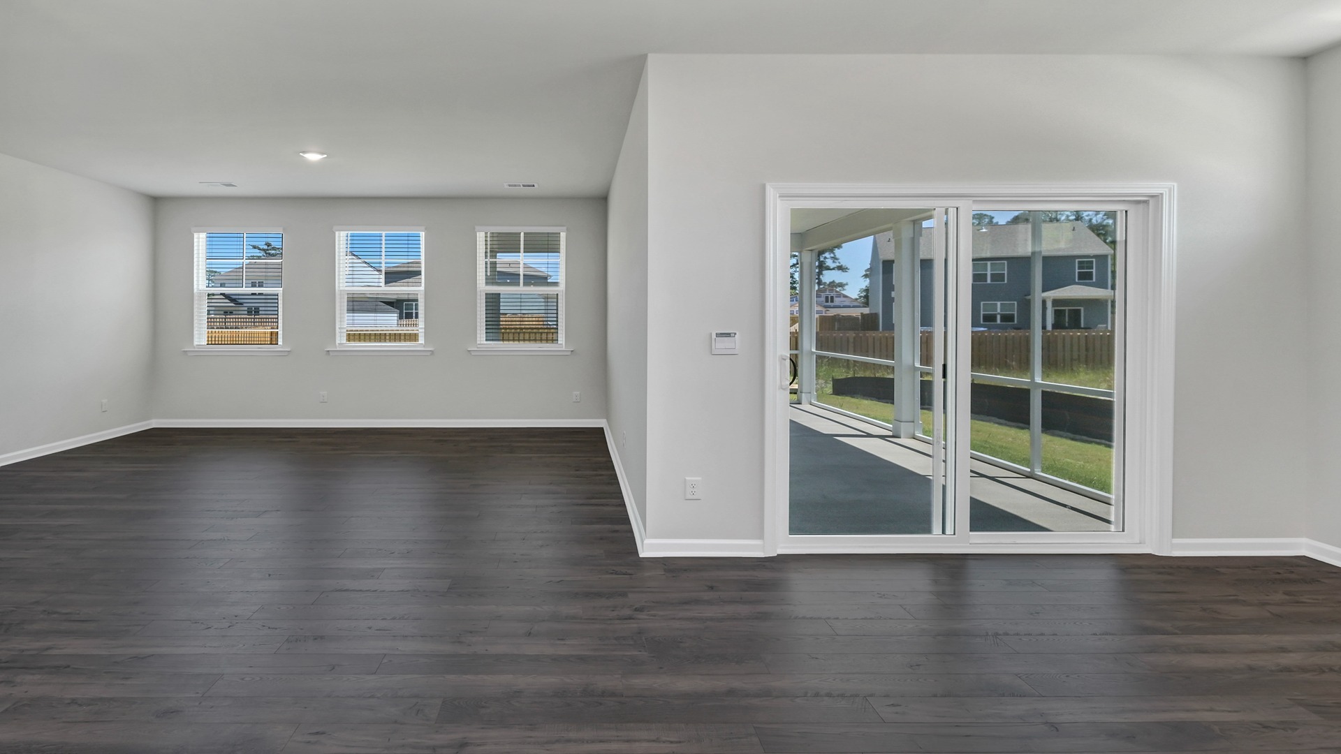 Open concept dining and living areas with lots of natural light