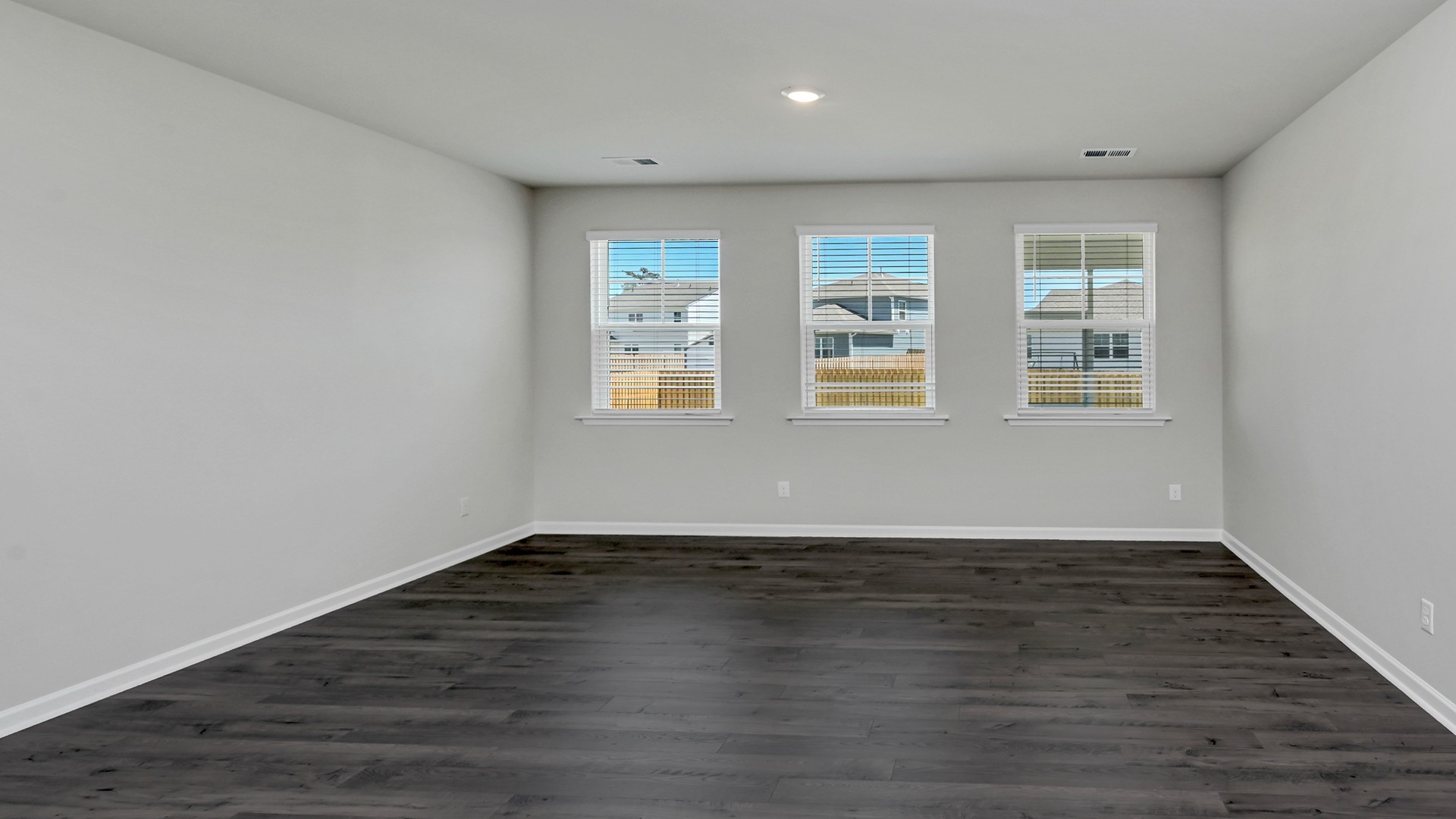 Natural light and RevWood floors in living room of home for sale at 177 Ruby Prince Road
