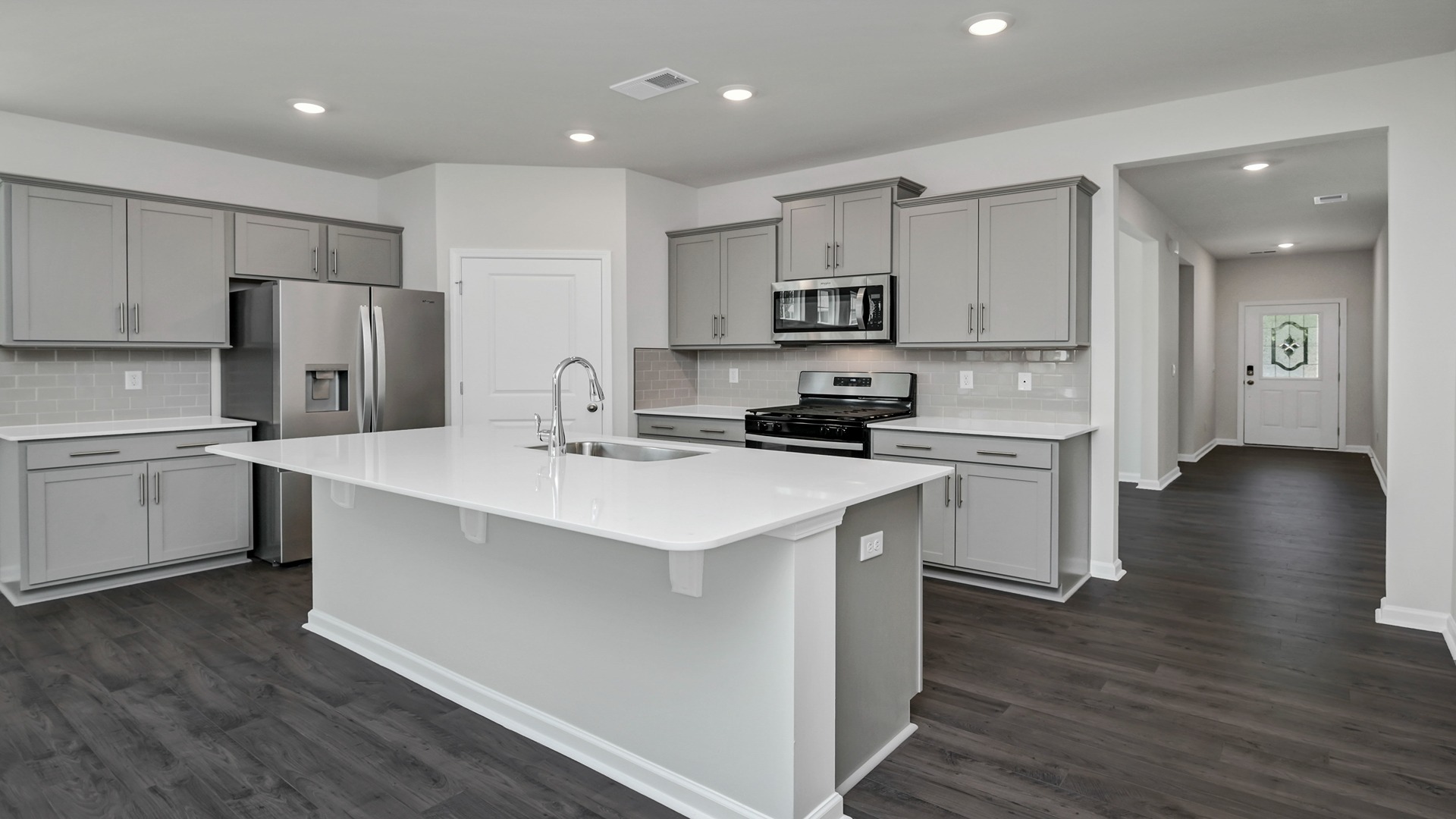Allex kitchen with gray cabinetry and white quartz countertops