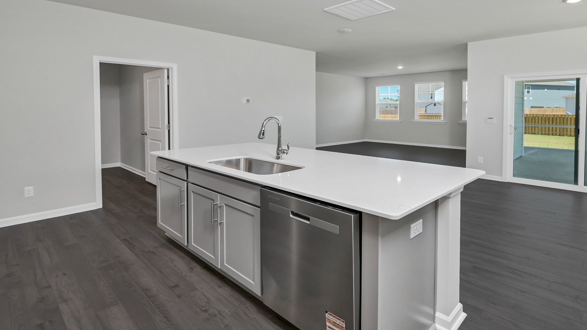 Floating island and laundry room access in kitchen