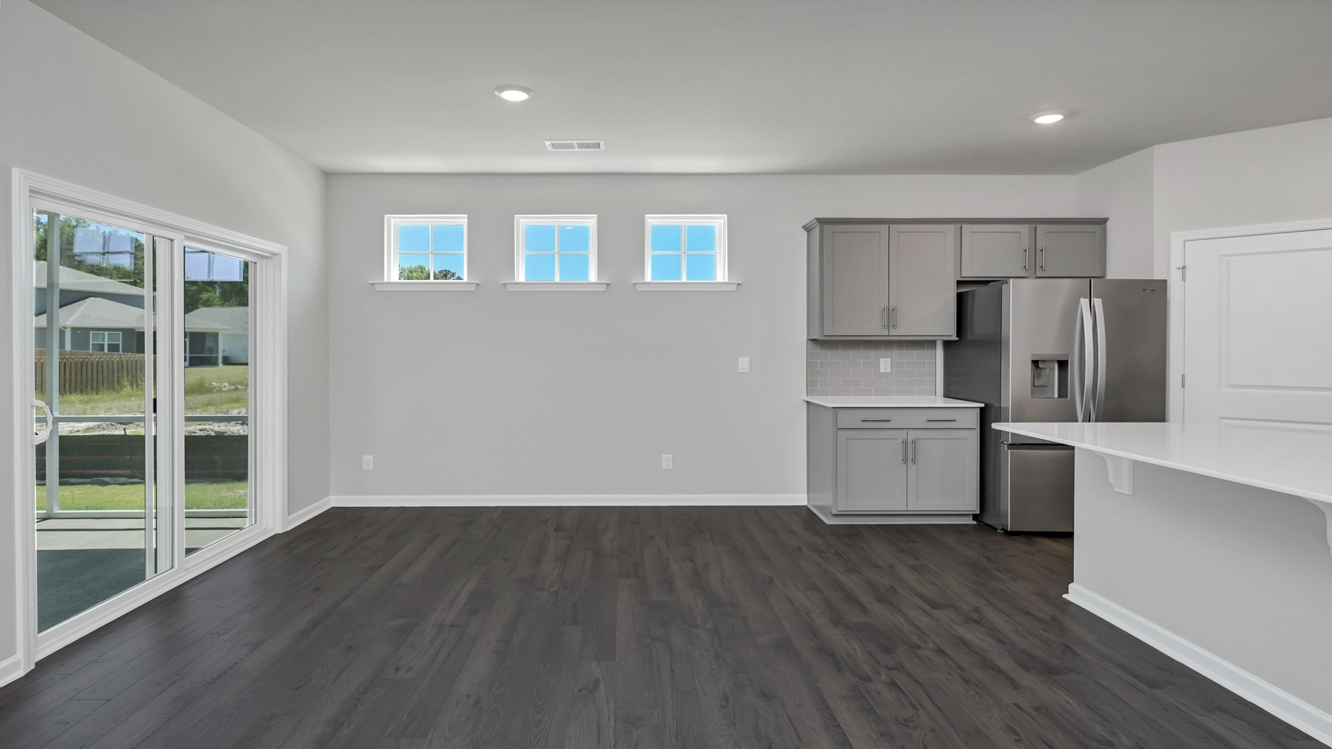 Dining area off the kitchen with lots of windows for natural light
