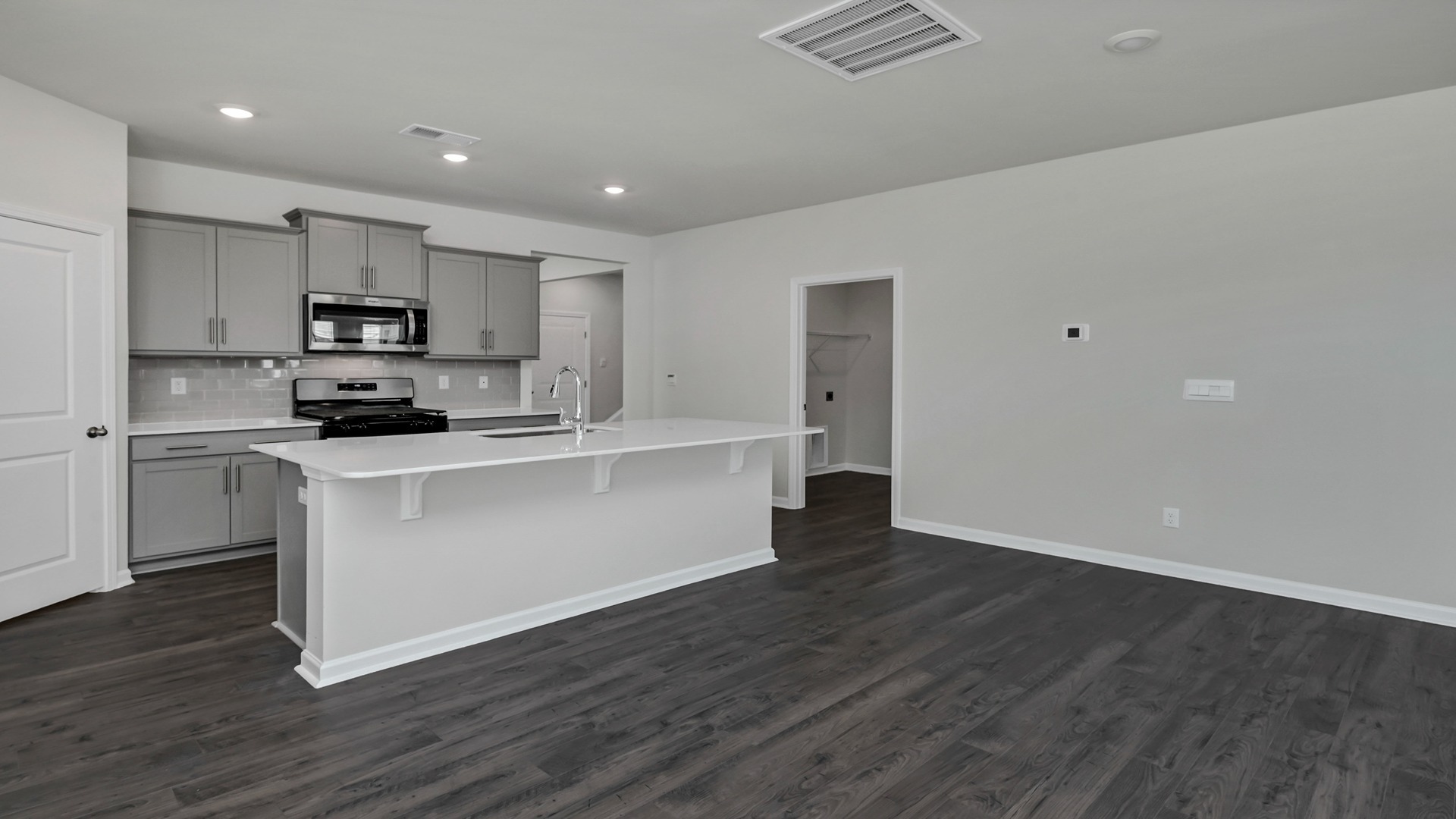 Access to centrally located laundry room off the kitchen space