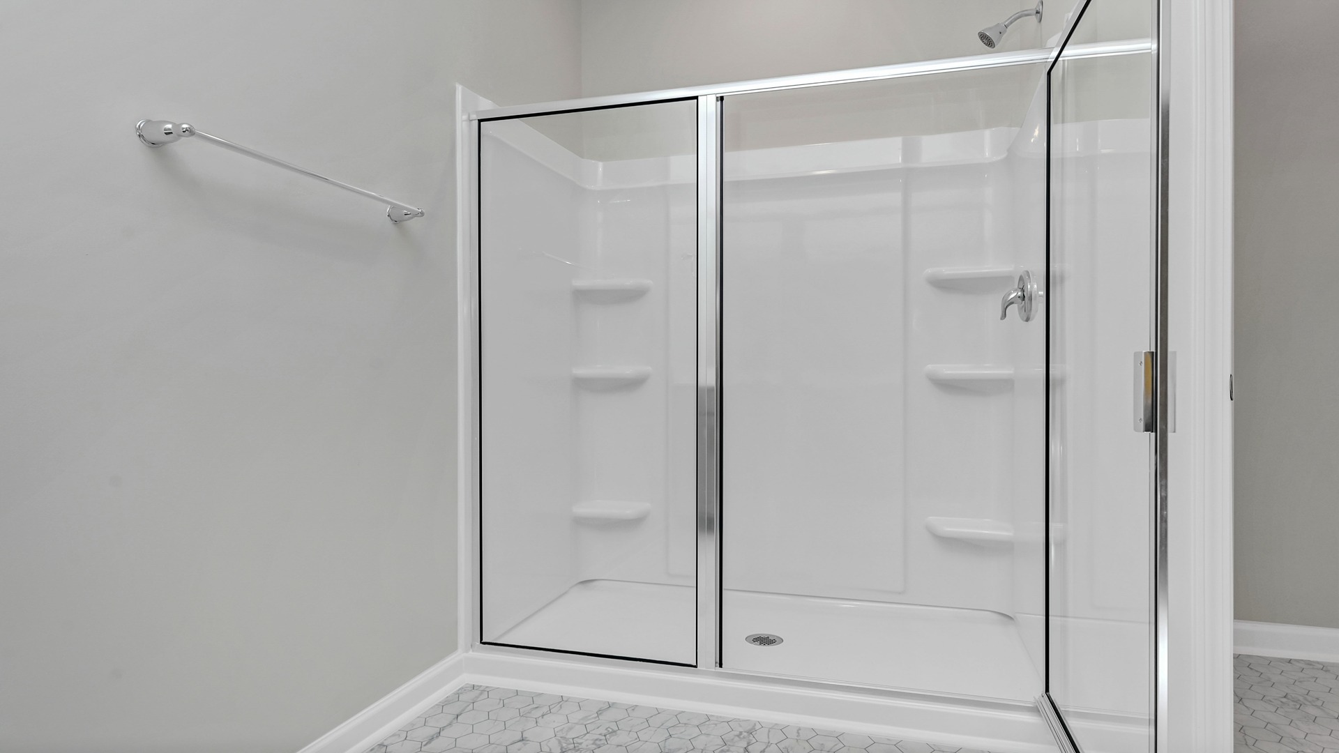 Standup primary shower with glass doors